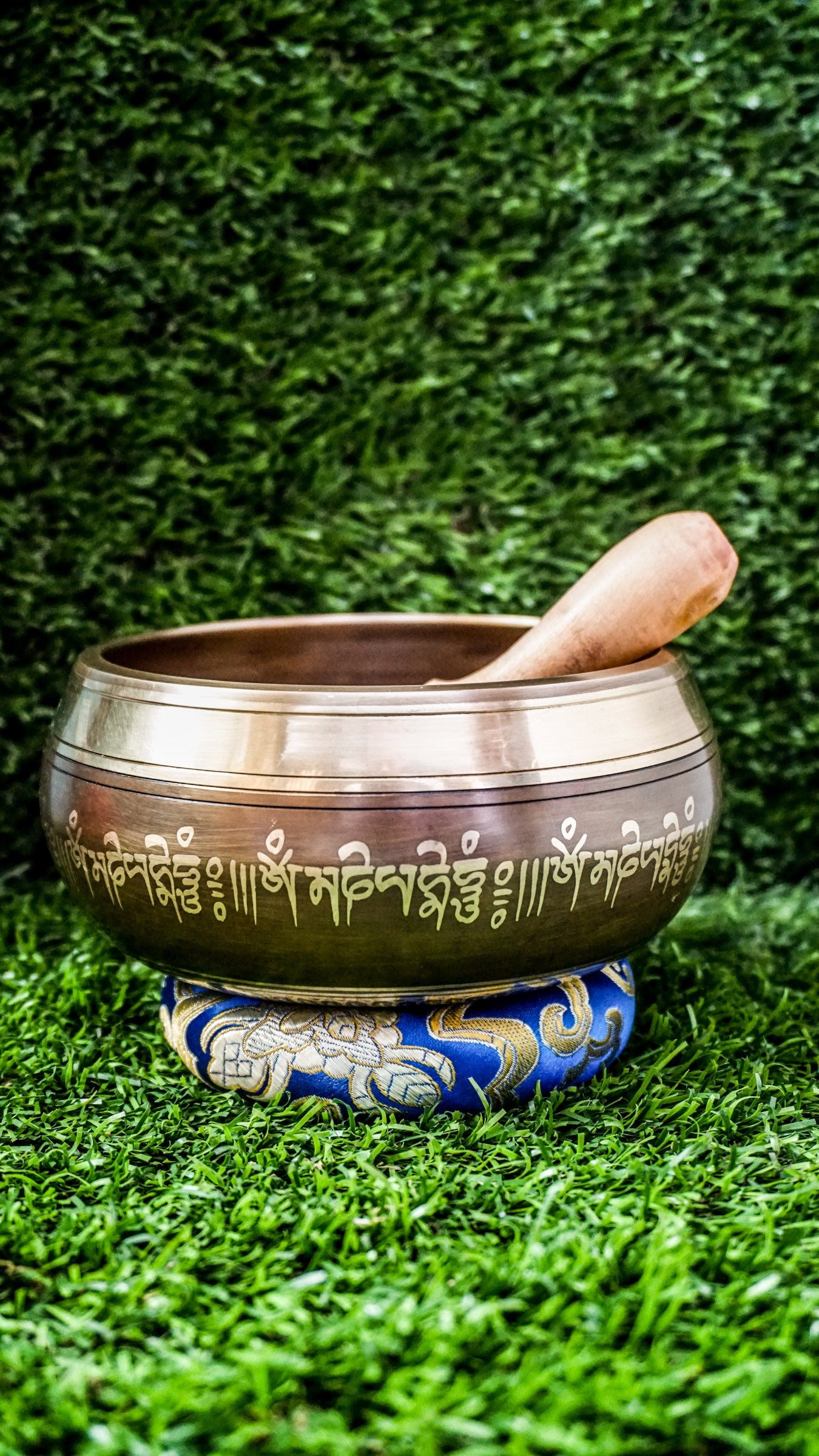The Buddha Mandala Bronze Singing Bowl features a meditating Buddha inside a sacred mandala with the Om Mani Padme Hum mantra outside. Its soothing tones promote peace, focus, and spiritual balance and are perfect for meditation and grounding your space.
