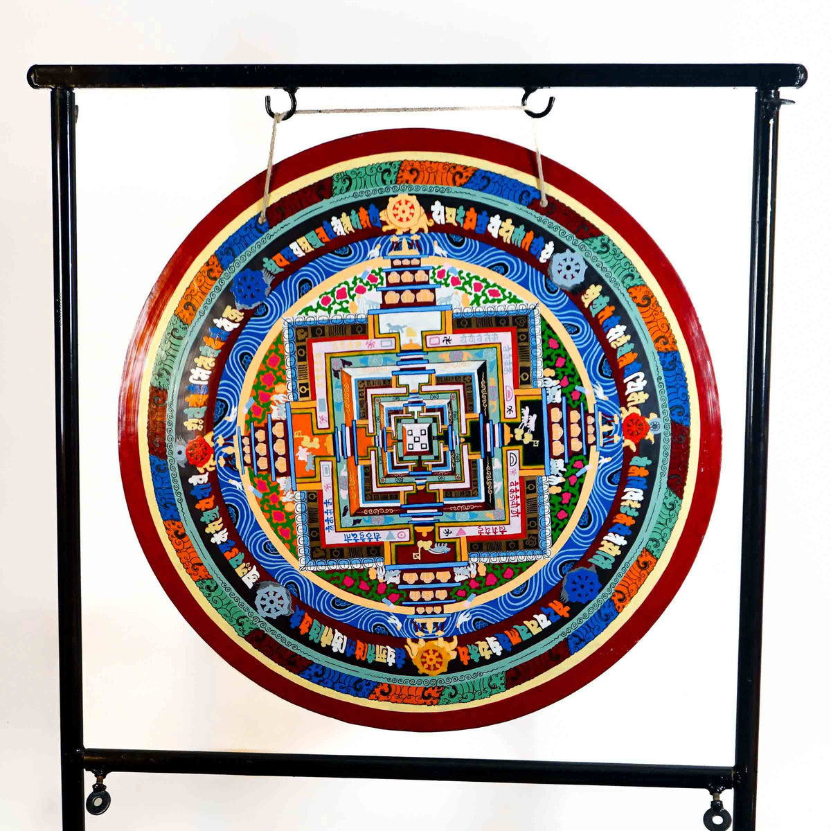 Kalachakra Mandala gong featuring colorful sacred geometry, Tibetan script, Buddhist symbols, and traditional Nepalese artwork