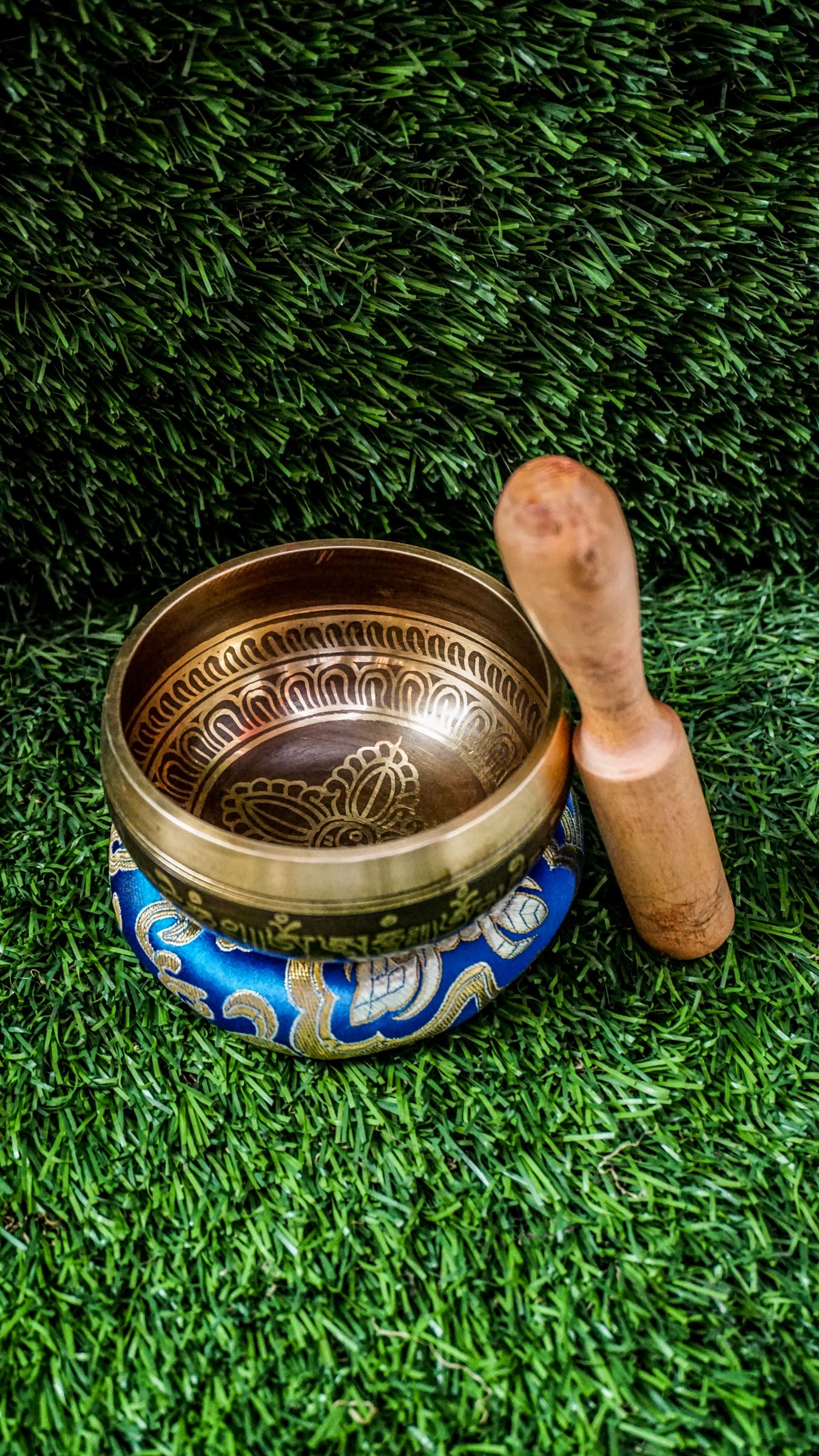 The Double Dorje Singing Bowl grounds and centers your energy. At its heart is the double dorje symbol, representing protection, balance, and spiritual strength. The outside is wrapped with the Om Mani Padme Hum mantra, adding compassion and focus. It produces deep, steady tones perfect for grounding meditation or creating calm. Includes singing bowl, wooden mallet, and silk cushion. Wipe clean and store dry. Let this bowl be your anchor for stillness and strength.