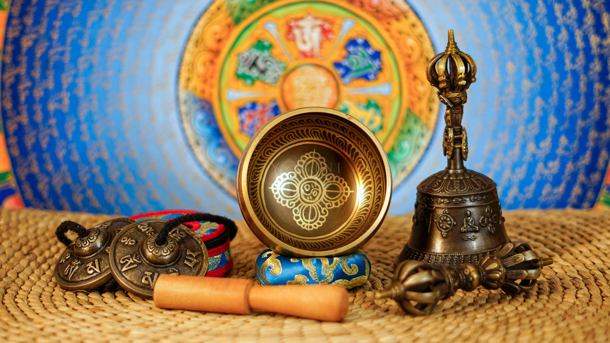 Complete Buddhist ritual set from Nepal featuring singing bowl, tingsha, bell, vajra, cushion and traditional accessories