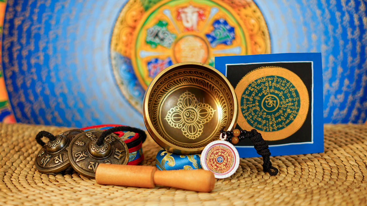 Himalayan Buddhist meditation set with singing bowl, Ashtamangala tingsha, cushion, wooden mallet and traditional accessories