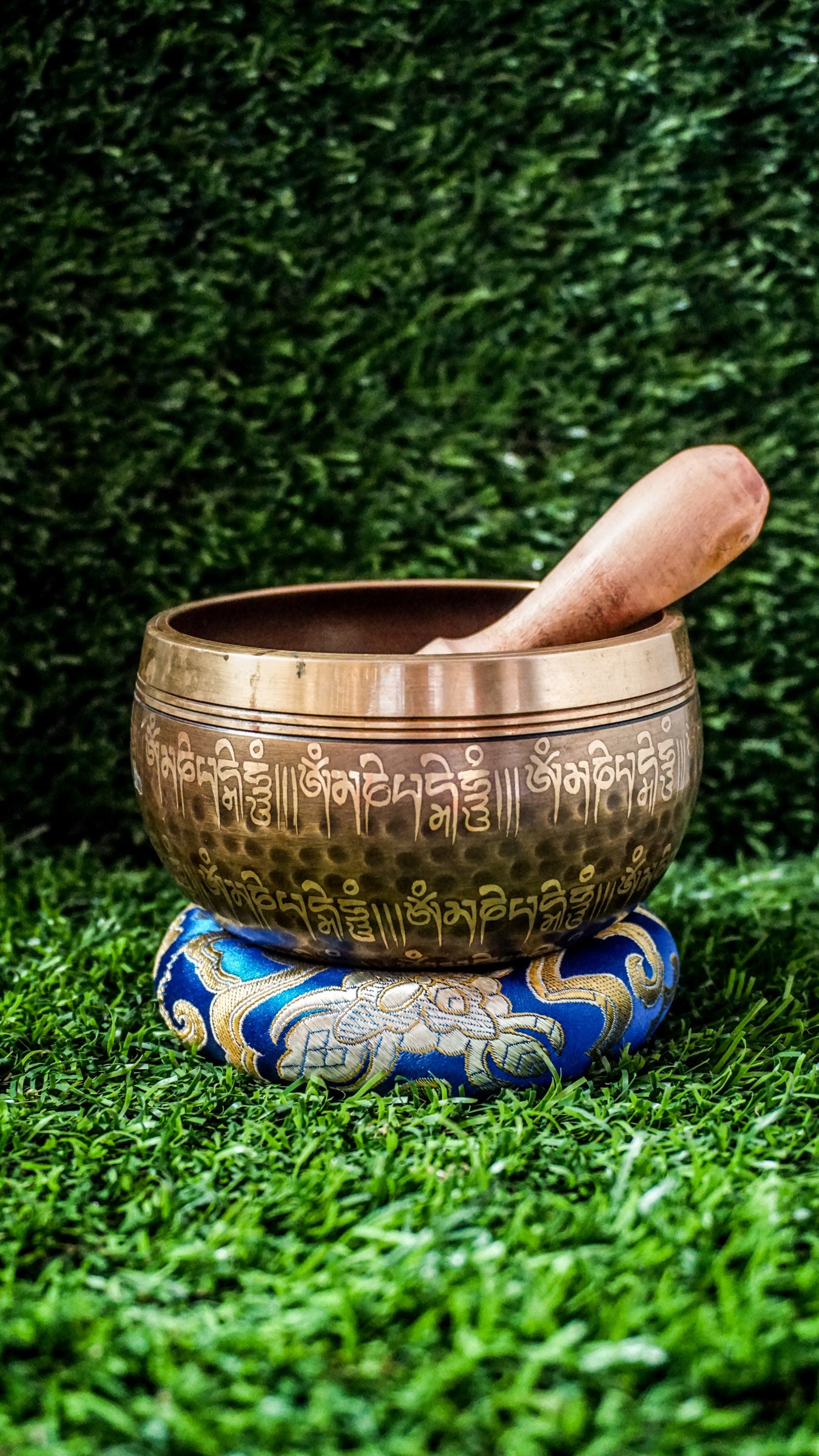 The Lingam Singing Bowl features a central lingam symbolizing divine creation and balance. The Om Mani Padme Hum mantra circles the inside and outside, creating harmony and protection. It produces a deep, steady tone that supports meditation, grounding, and focus. Includes wooden mallet and silk cushion.