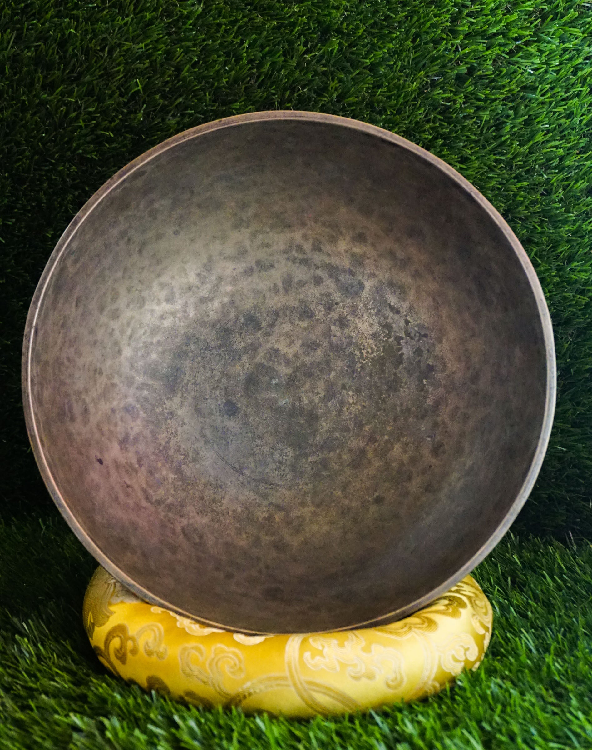 Semi-antique peacock carved singing bowl handcrafted in Nepal with detailed peacock motifs for meditation and healing.