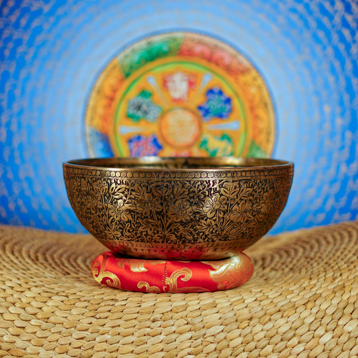 Semi antique floral engraved Tibetan singing bowl handcrafted in Nepal with detailed flower and foliage design