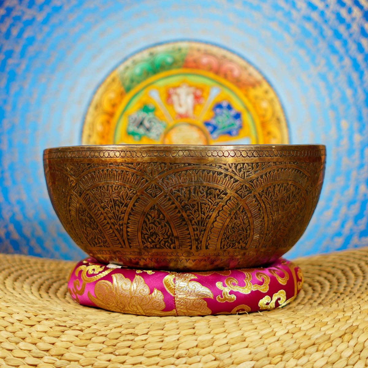 Semi antique singing bowl with intricate arch and floral engraved patterns in an aged bronze finish