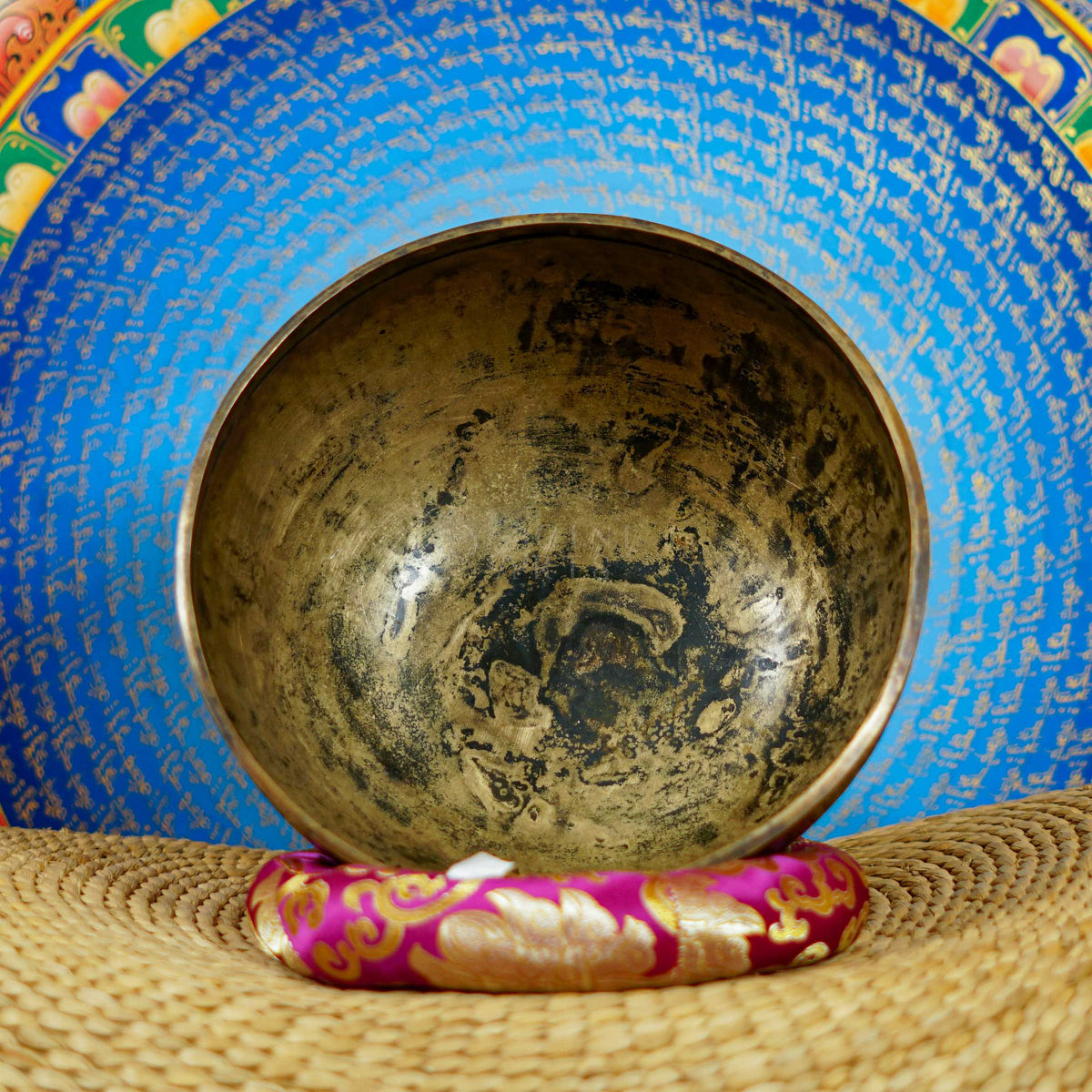 Semi antique singing bowl with intricate star-shaped floral engraving and traditional botanical patterns