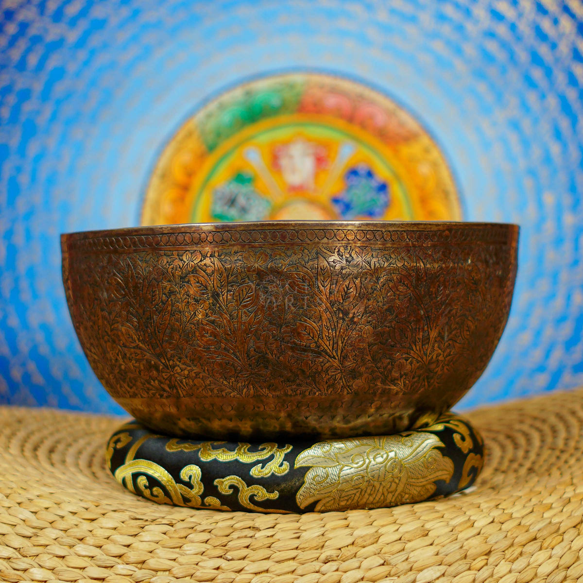 Semi antique singing bowl with intricate floral and leaf engraving, traditional Himalayan design