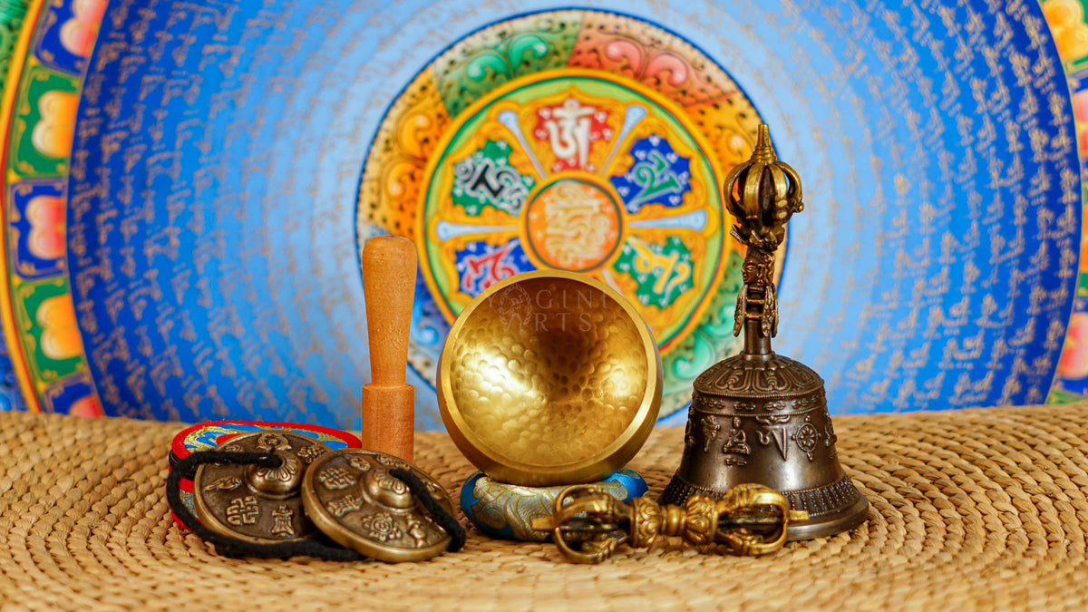 Buddhist meditation and ritual set from Nepal featuring singing bowl, tingsha, bell, vajra, cushion and traditional accessories