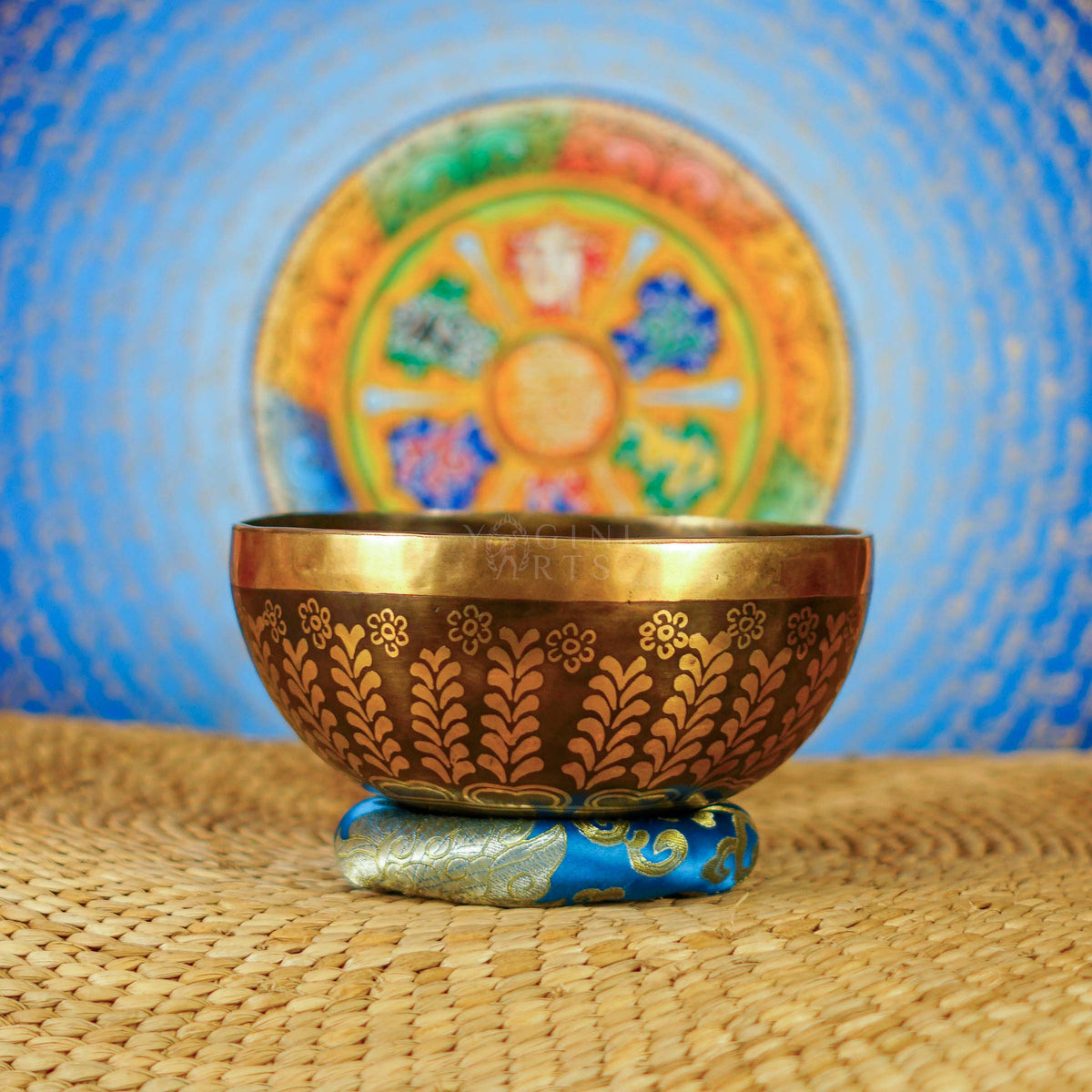 Handcrafted Yin Yang singing bowl from Nepal with floral engraving and bronze-gold finish for meditation and sound practice.