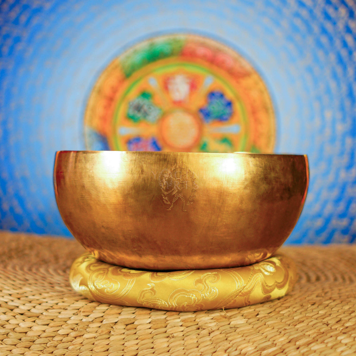 Side view of handcrafted Medicine Buddha singing bowl with golden finish from Nepal