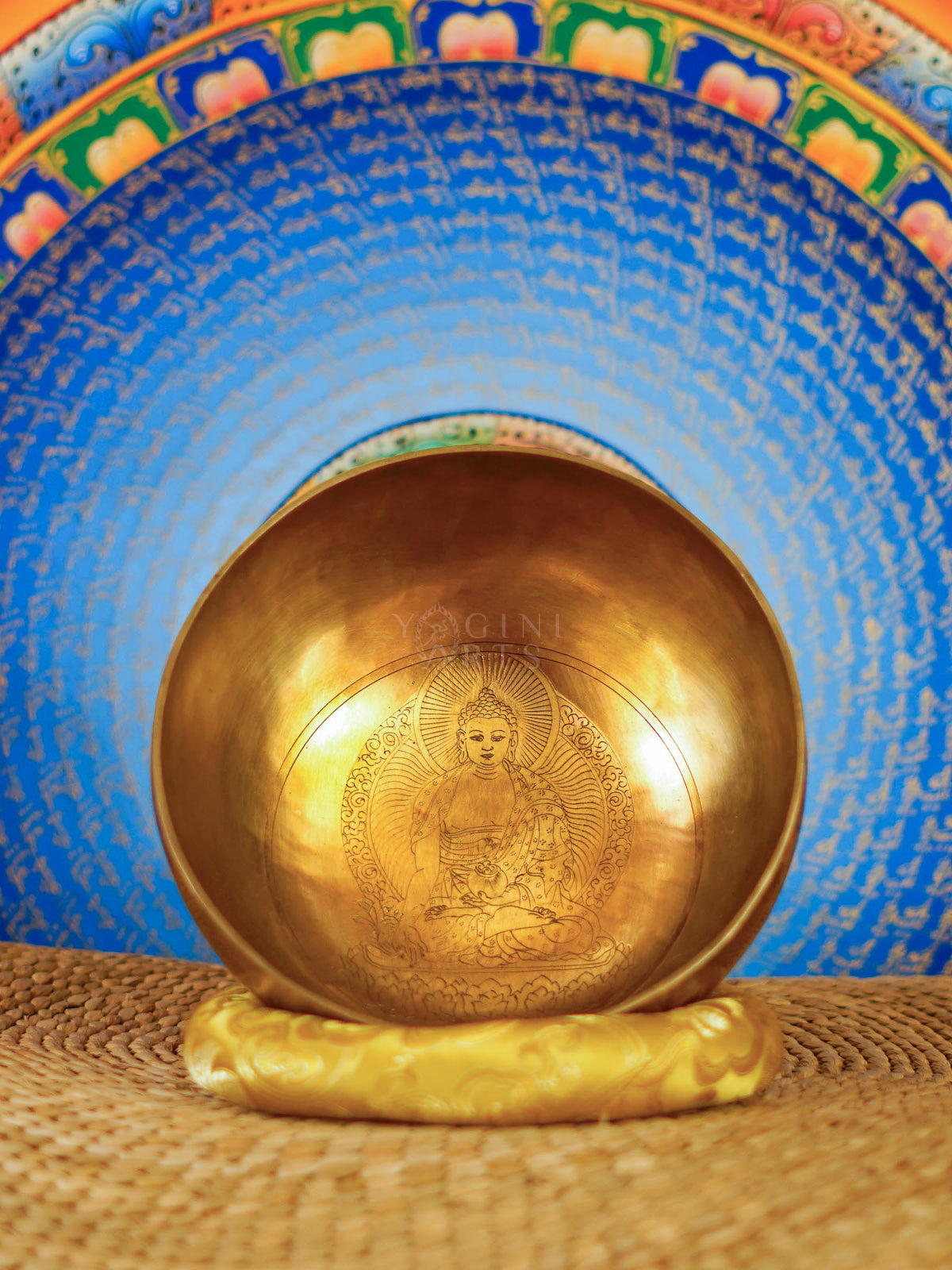 Interior of Medicine Buddha Tibetan singing bowl showing detailed engraved Buddha artwork