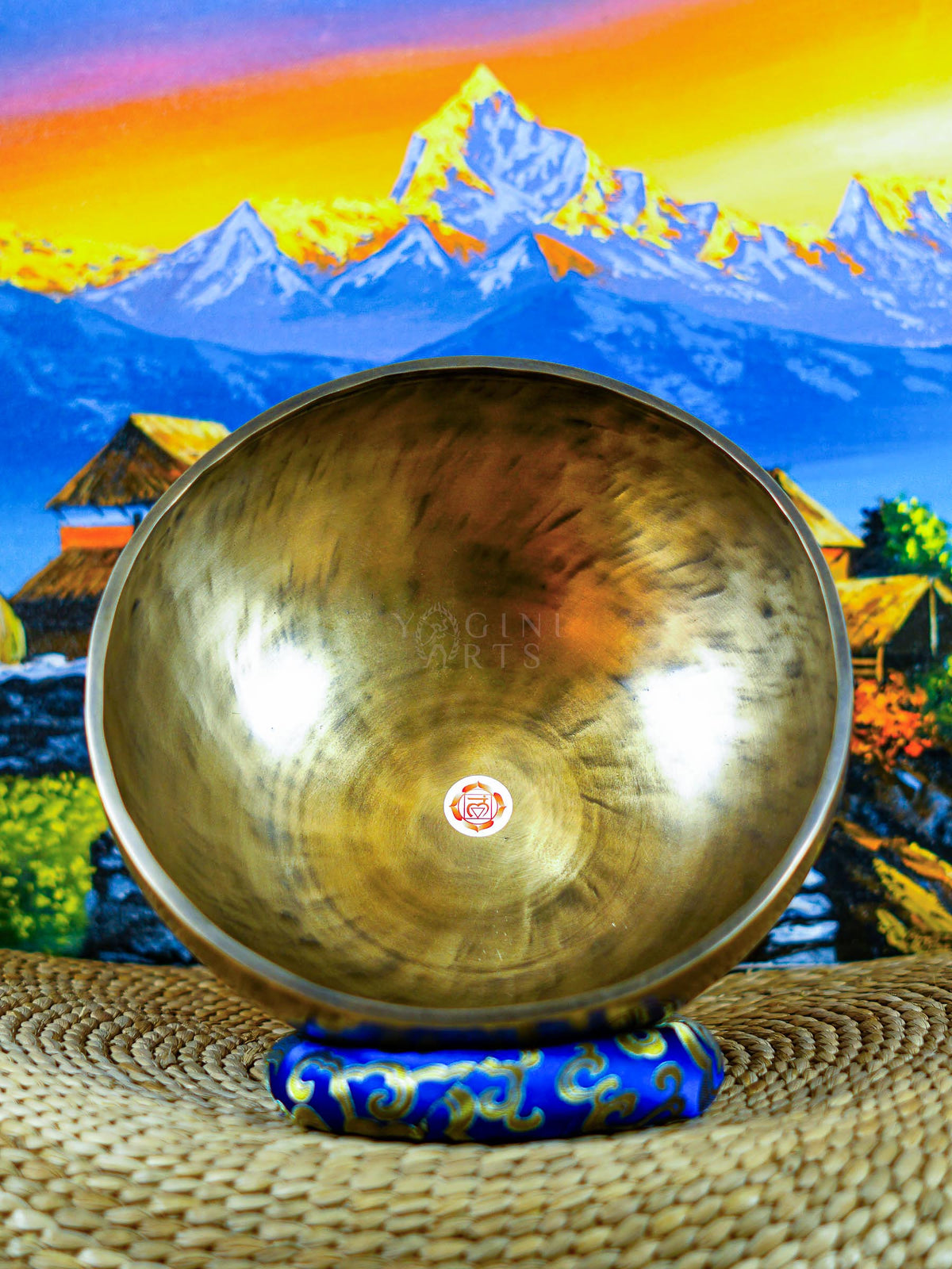Seven handcrafted Himalayan singing bowls arranged together, featuring graduated sizes, chakra symbols, and warm antique bronze-gold finishes.
