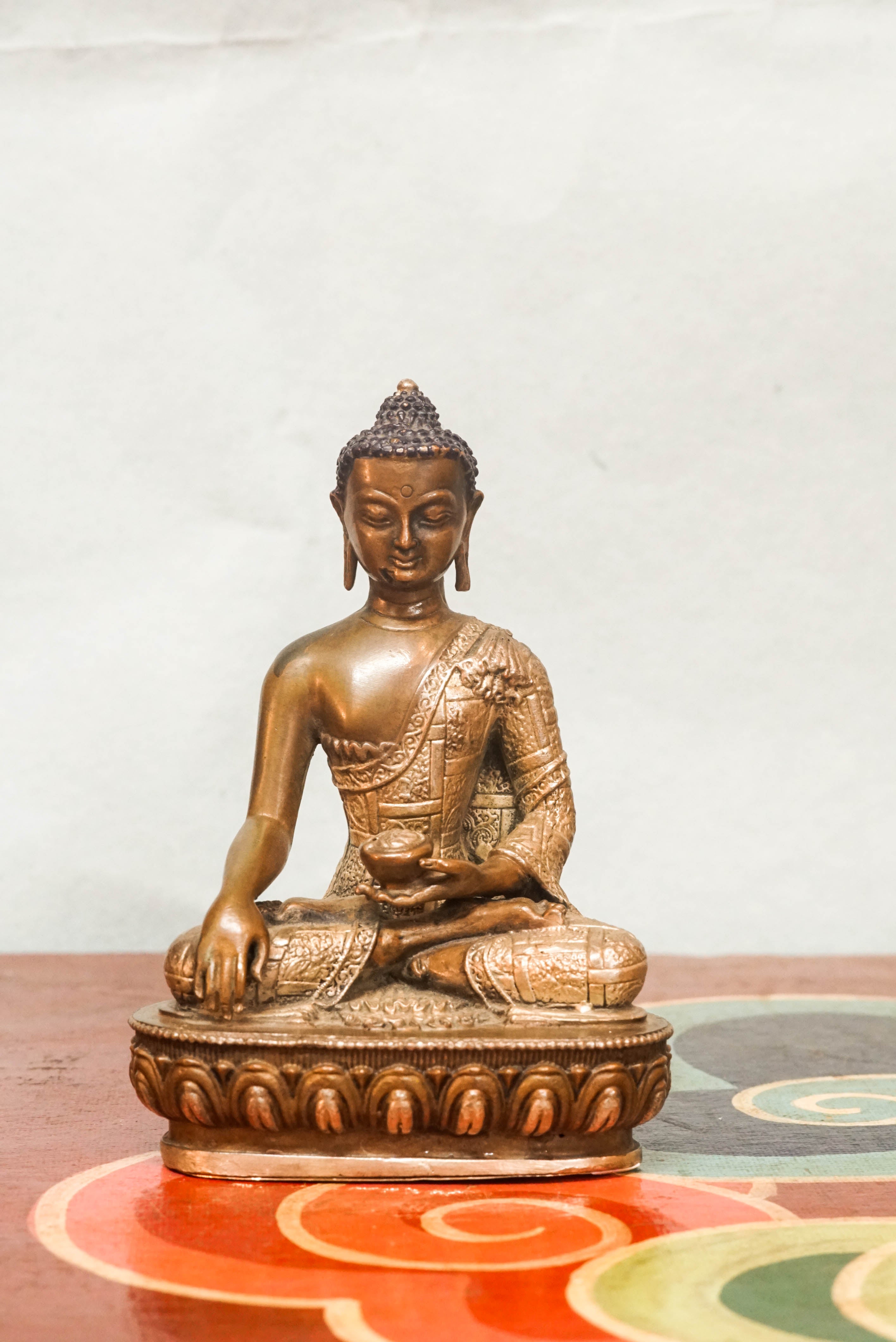 Shākyamuni Buddha statue, eyes closed in deep meditation. It captures calm, clarity, and spiritual depth symbolizing awakening, compassion, and serene mindfulness.