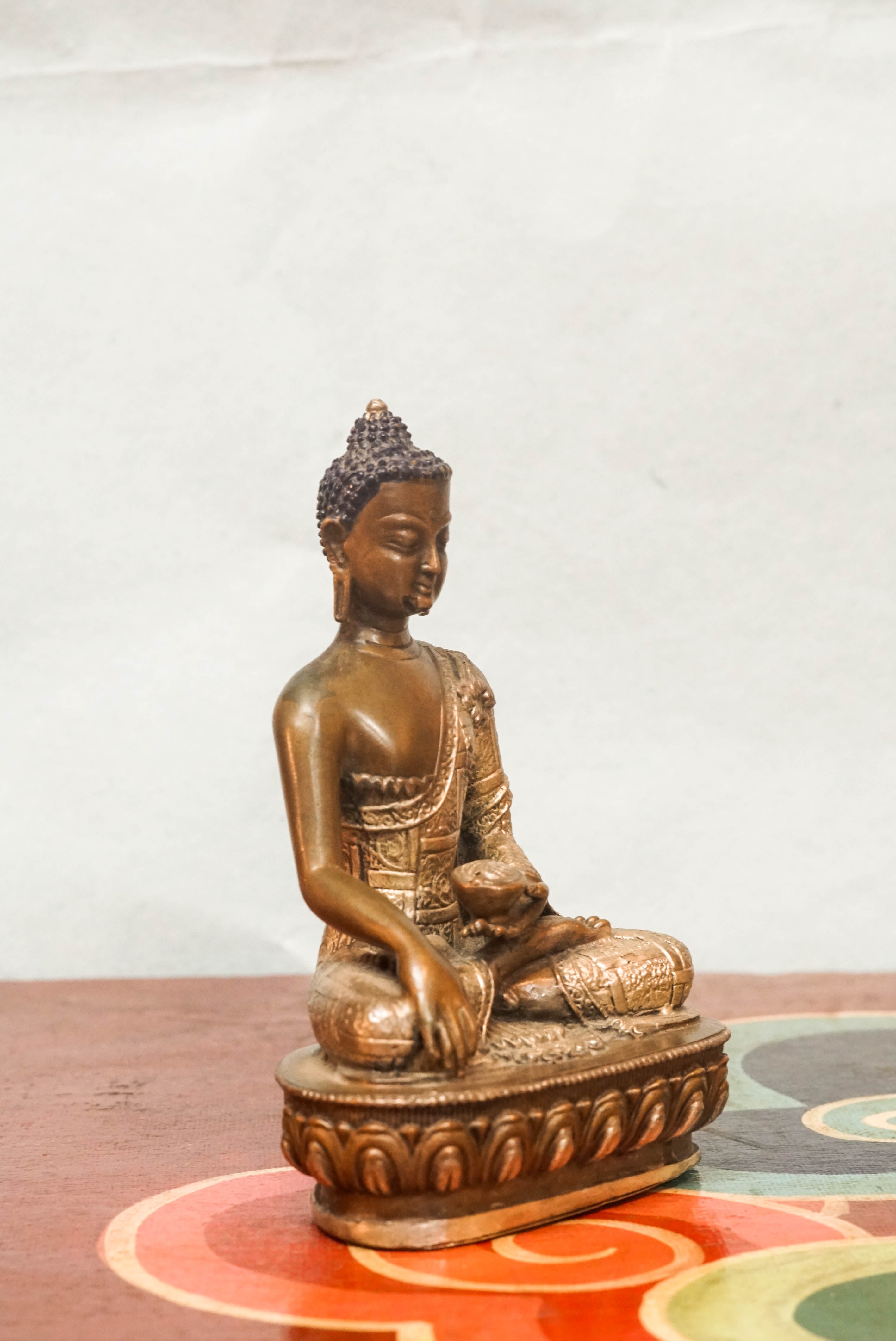 Shākyamuni Buddha statue, eyes closed in deep meditation. It captures calm, clarity, and spiritual depth symbolizing awakening, compassion, and serene mindfulness.