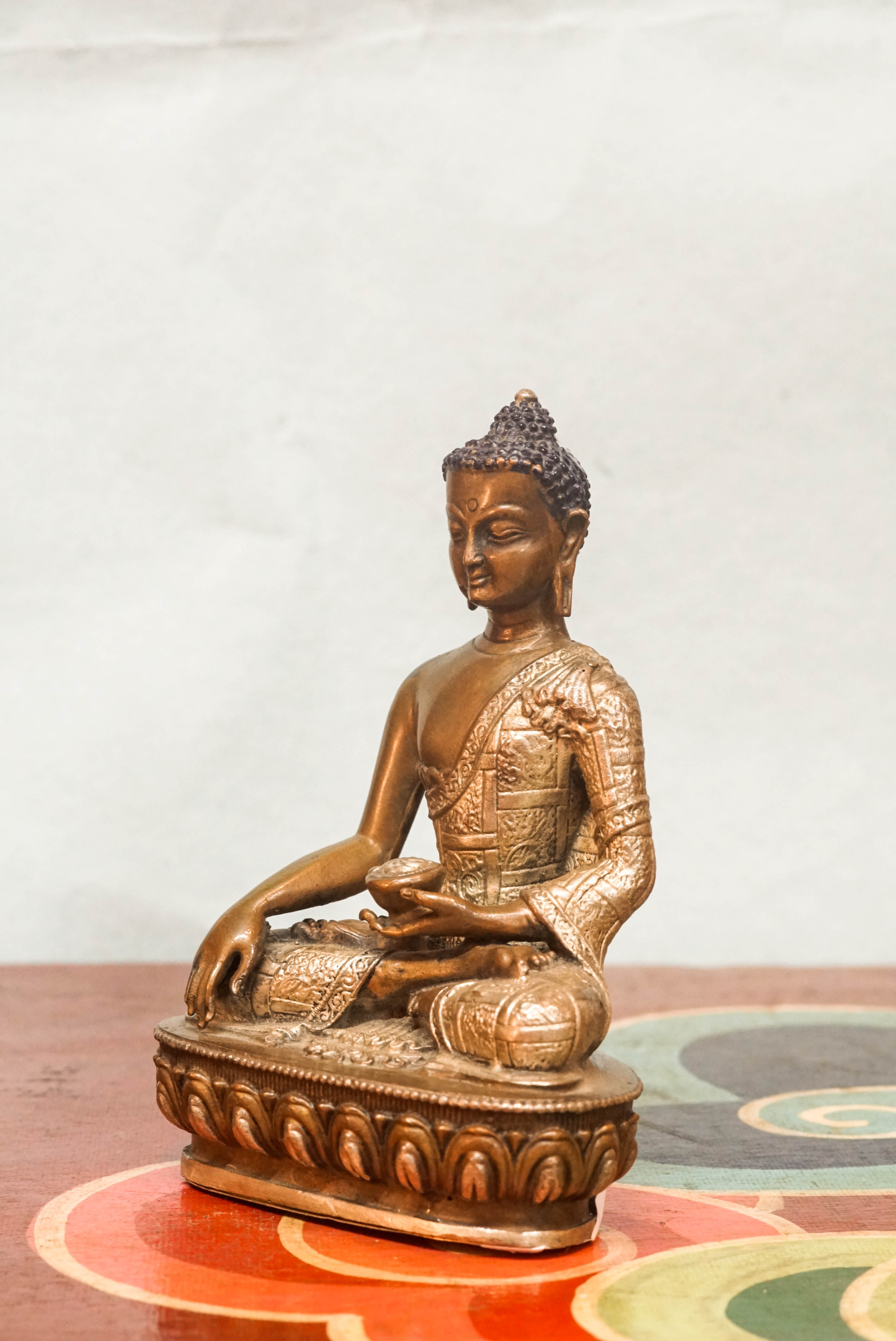 Shākyamuni Buddha statue, eyes closed in deep meditation. It captures calm, clarity, and spiritual depth symbolizing awakening, compassion, and serene mindfulness.