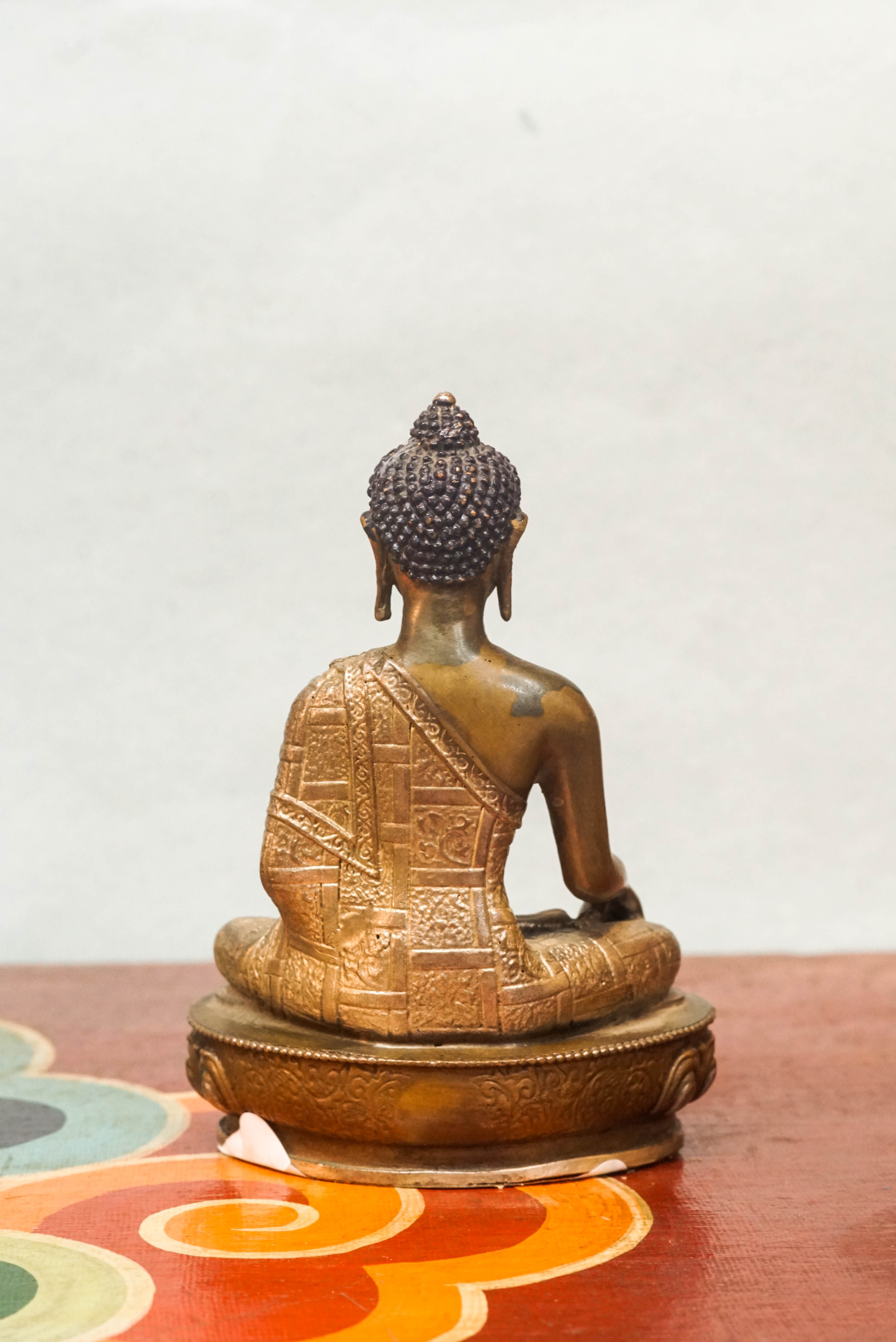 Shākyamuni Buddha statue, eyes closed in deep meditation. It captures calm, clarity, and spiritual depth symbolizing awakening, compassion, and serene mindfulness.
