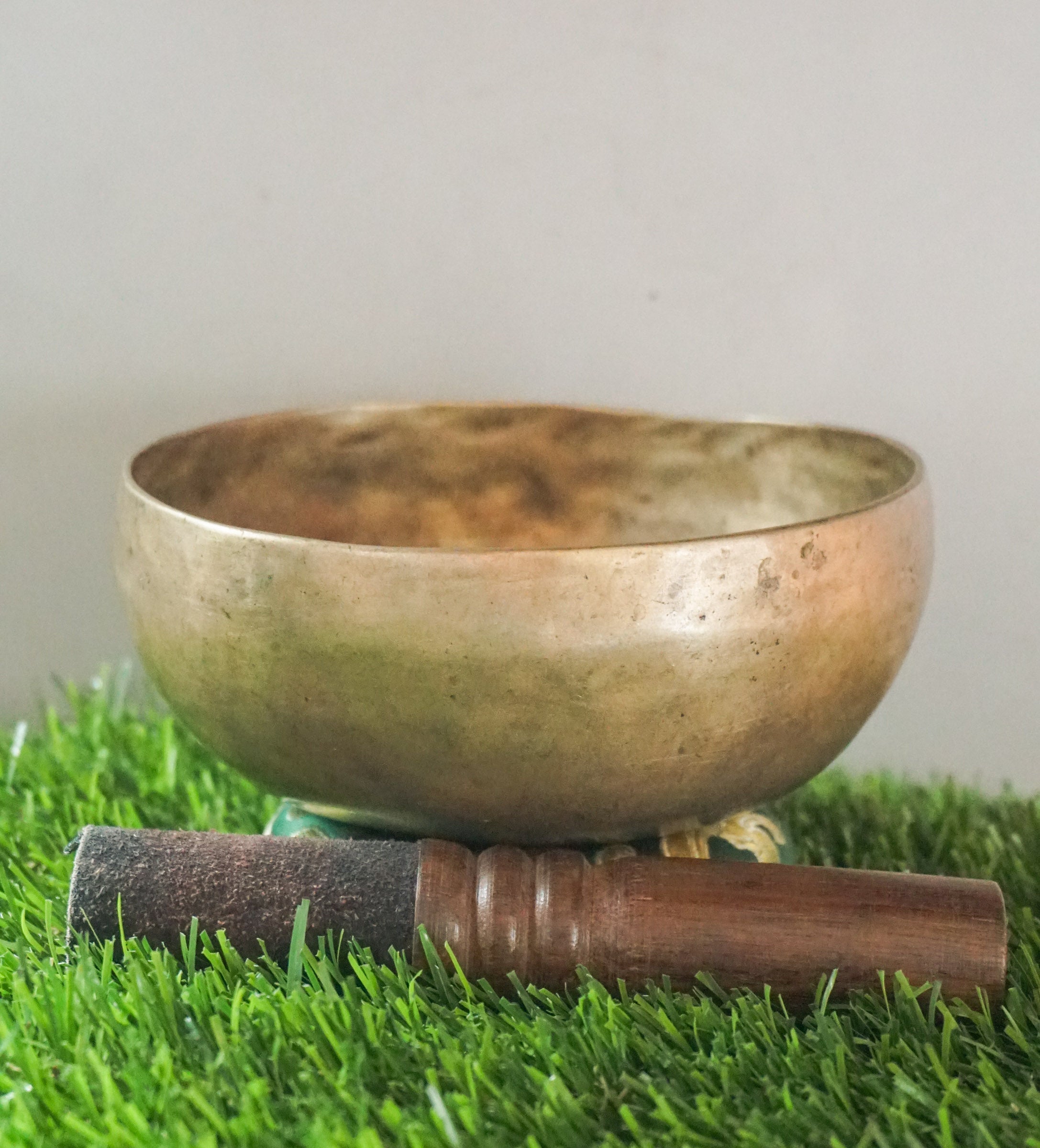 Semi-antique Tibetan singing bowl handcrafted in Nepal with aged patina.