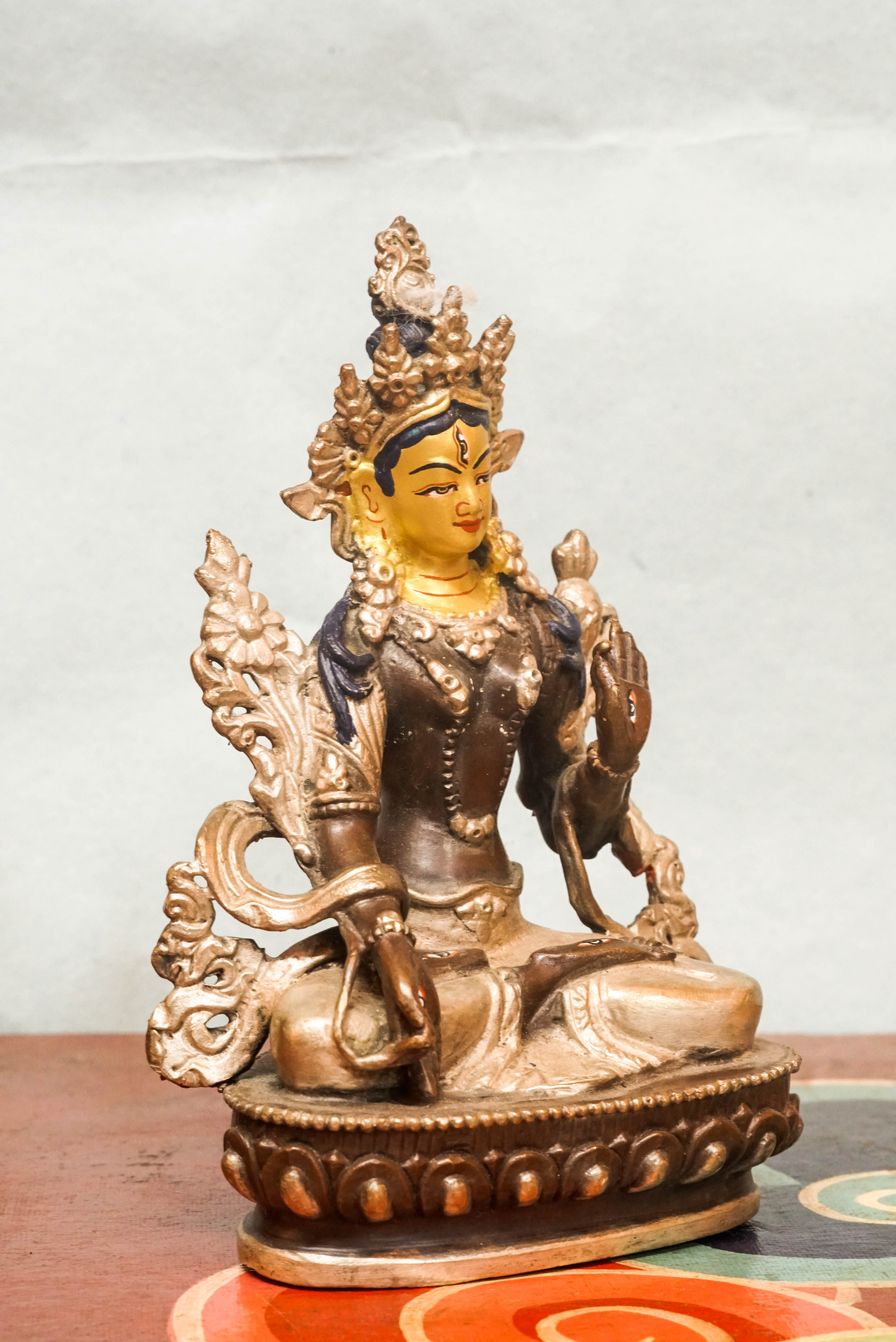 White Tara statue, a symbol of healing, compassion. With seven all-seeing eyes and serene lotus posture, she brings peaceful energy and protection.
