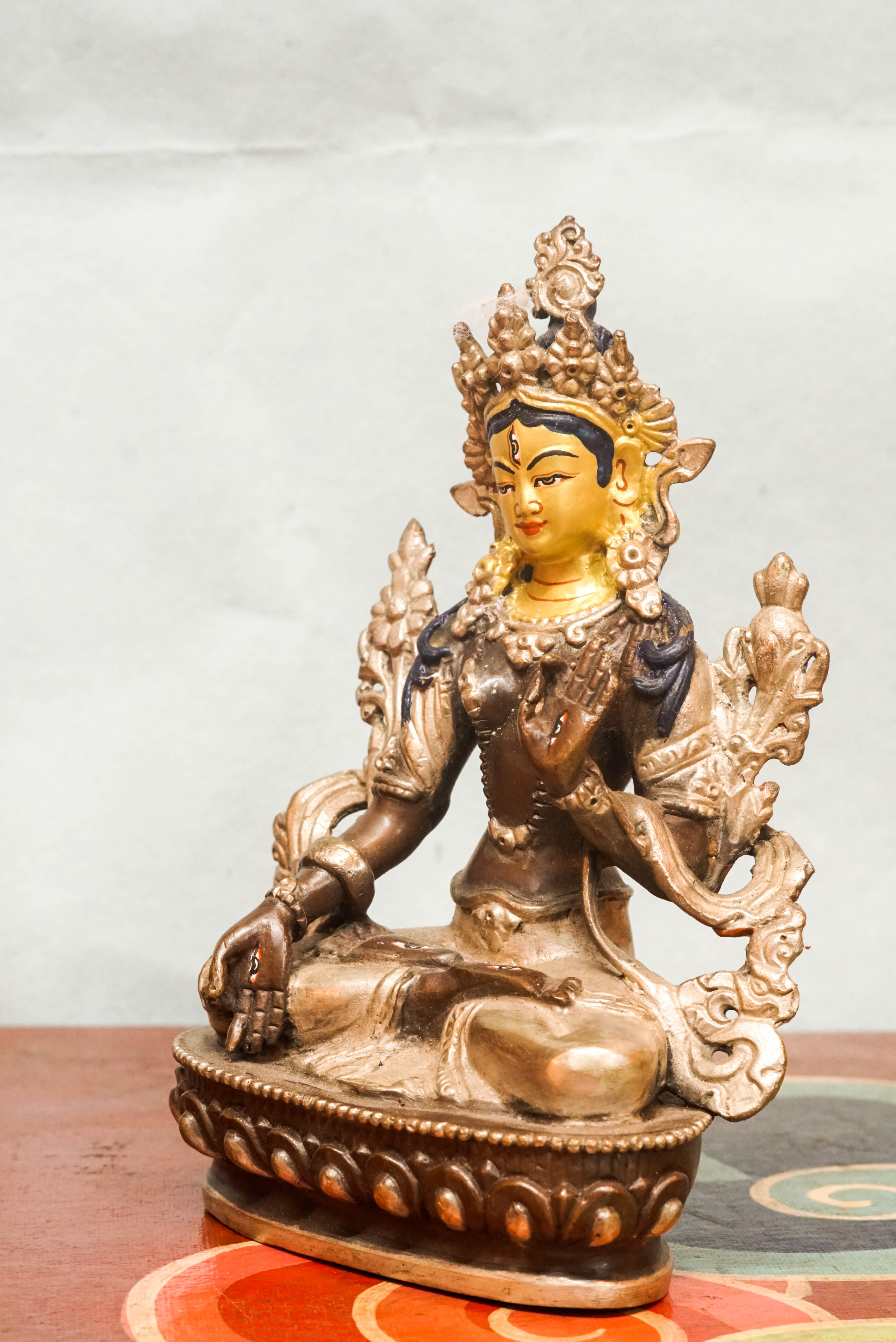 White Tara statue, a symbol of healing, compassion. With seven all-seeing eyes and serene lotus posture, she brings peaceful energy and protection.