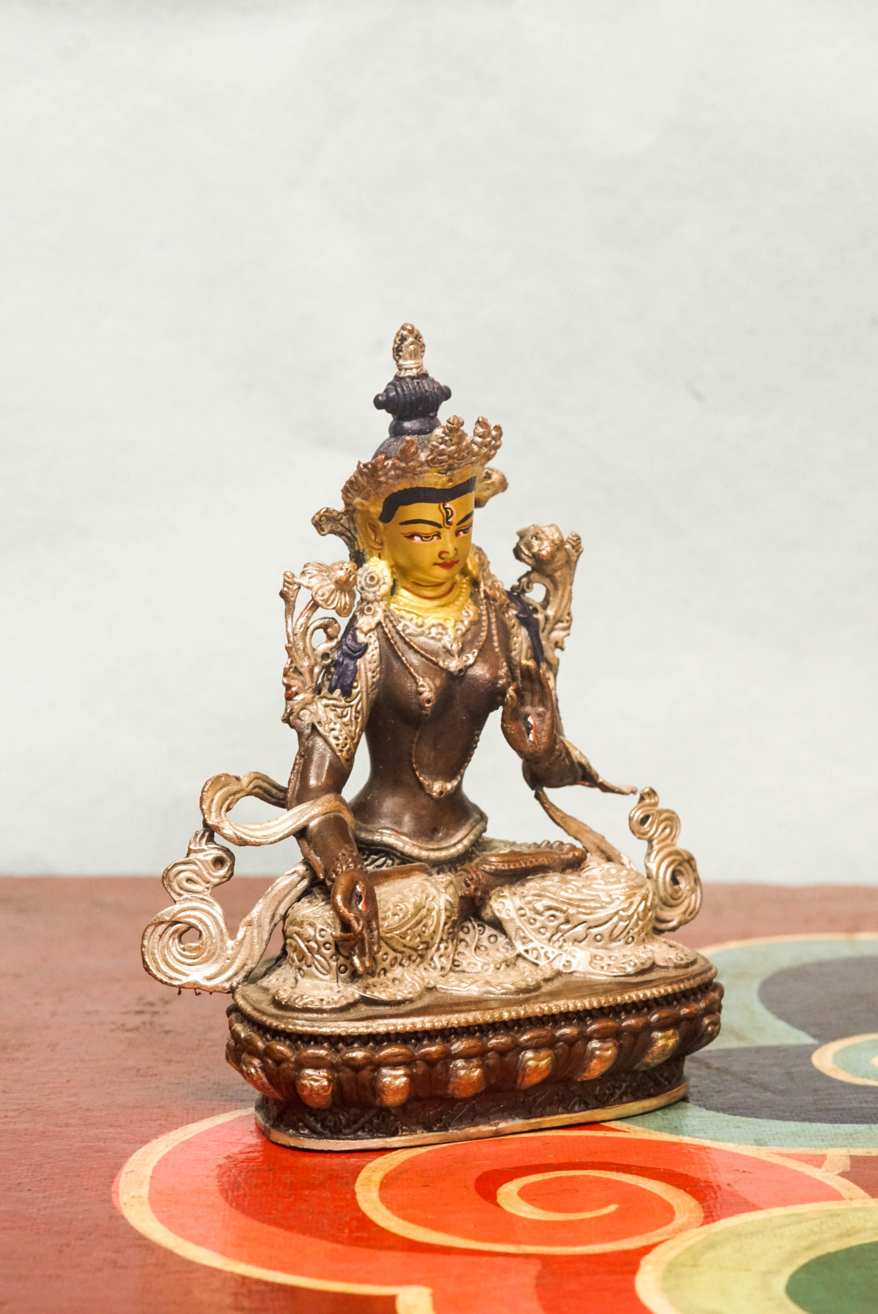The silver-covered White Tara statue, she sits in serene lotus posture with seven eyes symbolizing watchful wisdom. A radiant symbol of peace and longevity, meditation, or as a meaningful spiritual gift.