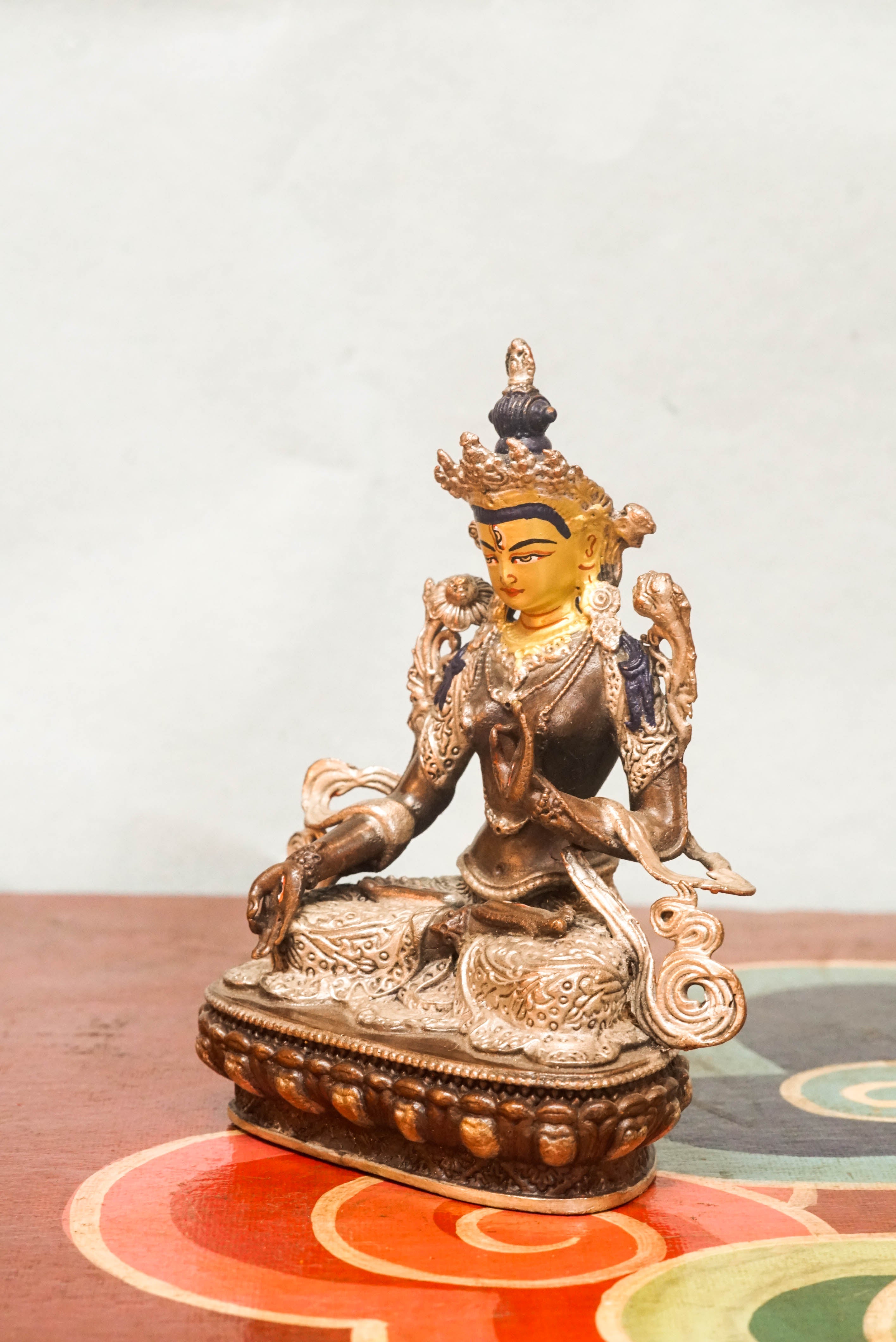 The silver-covered White Tara statue, she sits in serene lotus posture with seven eyes symbolizing watchful wisdom. A radiant symbol of peace and longevity, meditation, or as a meaningful spiritual gift.