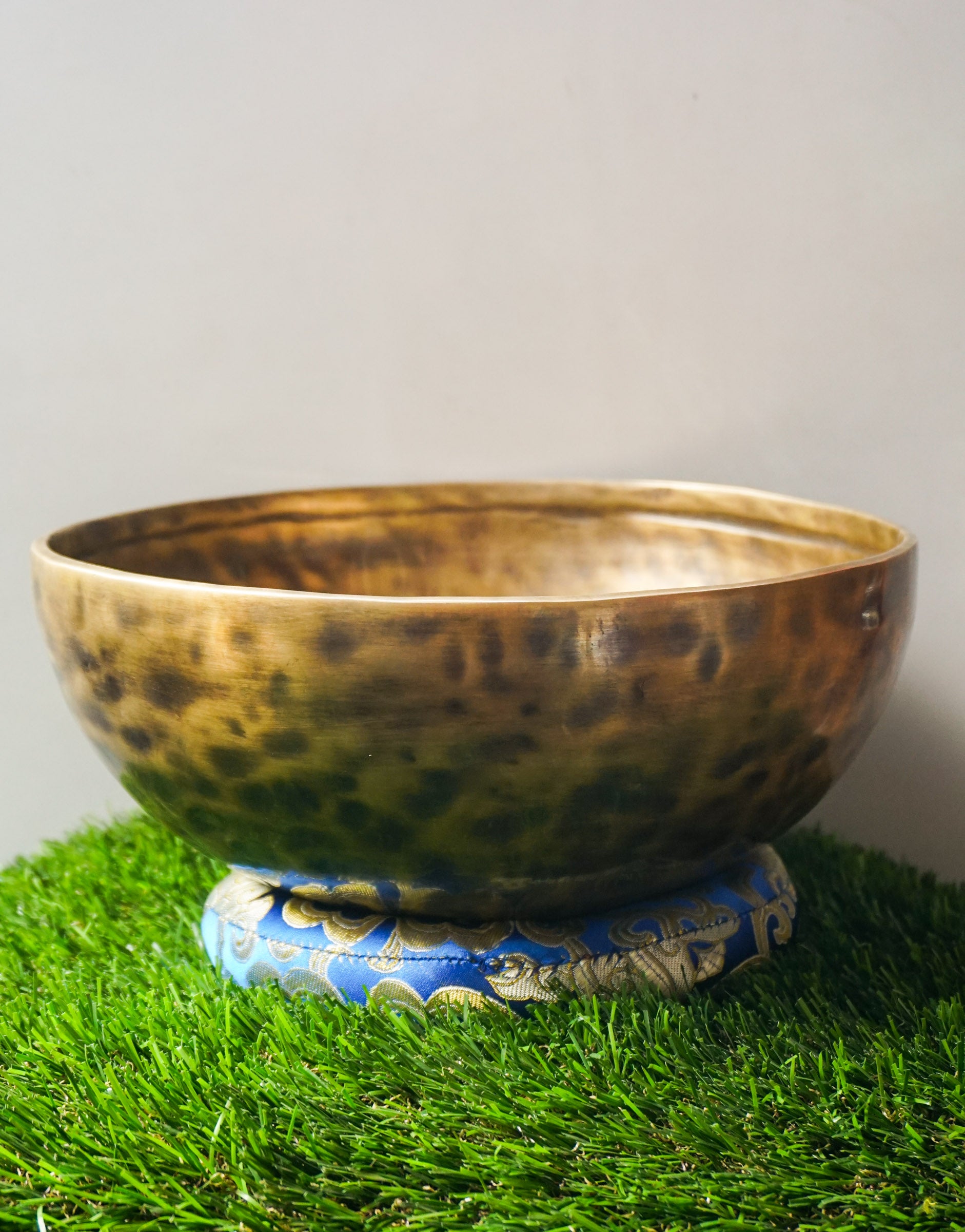 Hand-hammered Tiger Style Tibetan Singing Bowl from Kathmandu Nepal with tiger stripe patterns, used in Buddhist meditation, sound healing, and Himalayan mindfulness practice.