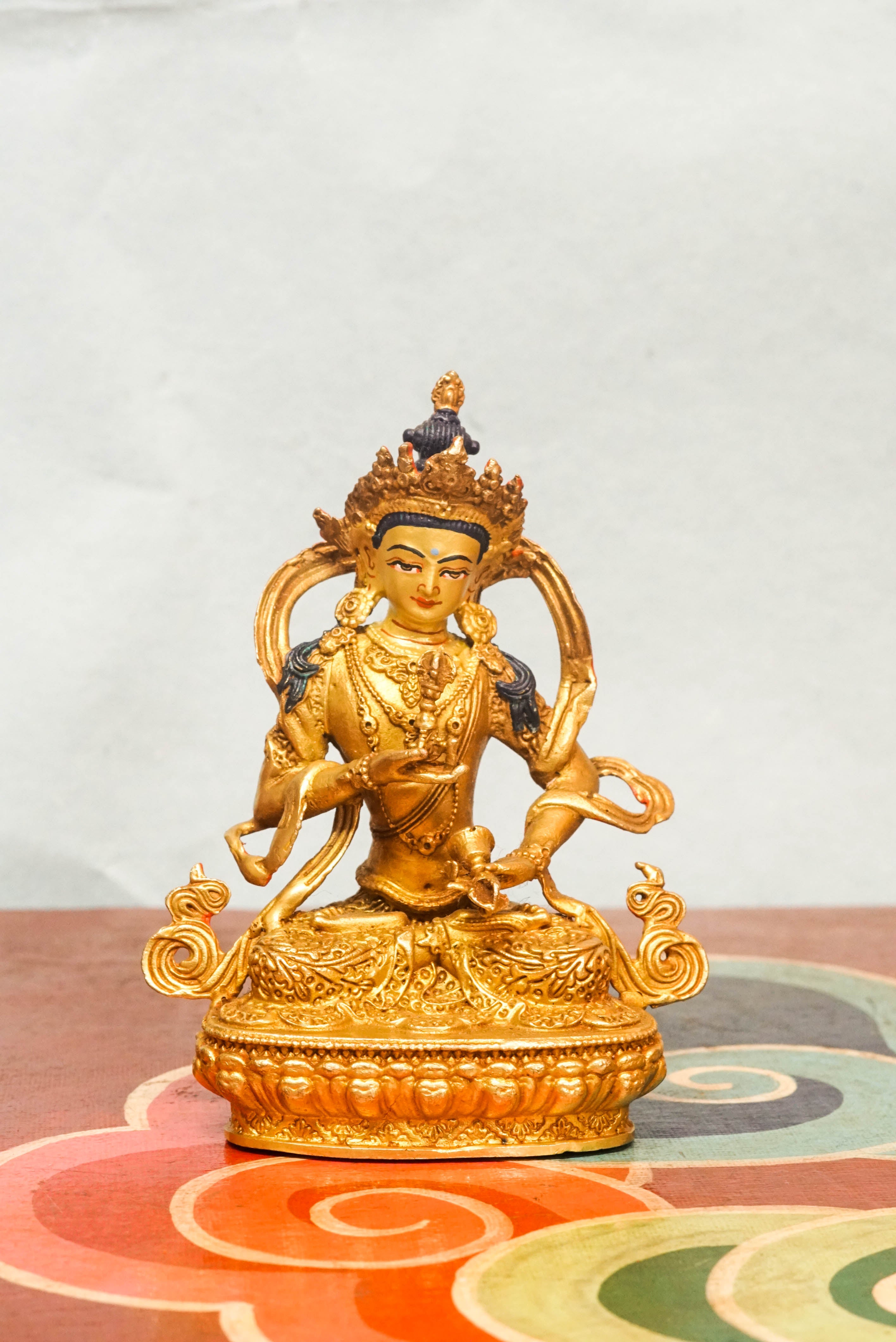 Invite purity and spiritual cleansing with this handcrafted Vajrasattva statue. Depicted in the diamond posture, holding a vajra and bell symbolizing wisdom and compassion. This statue inspires inner clarity and spiritual renewal.