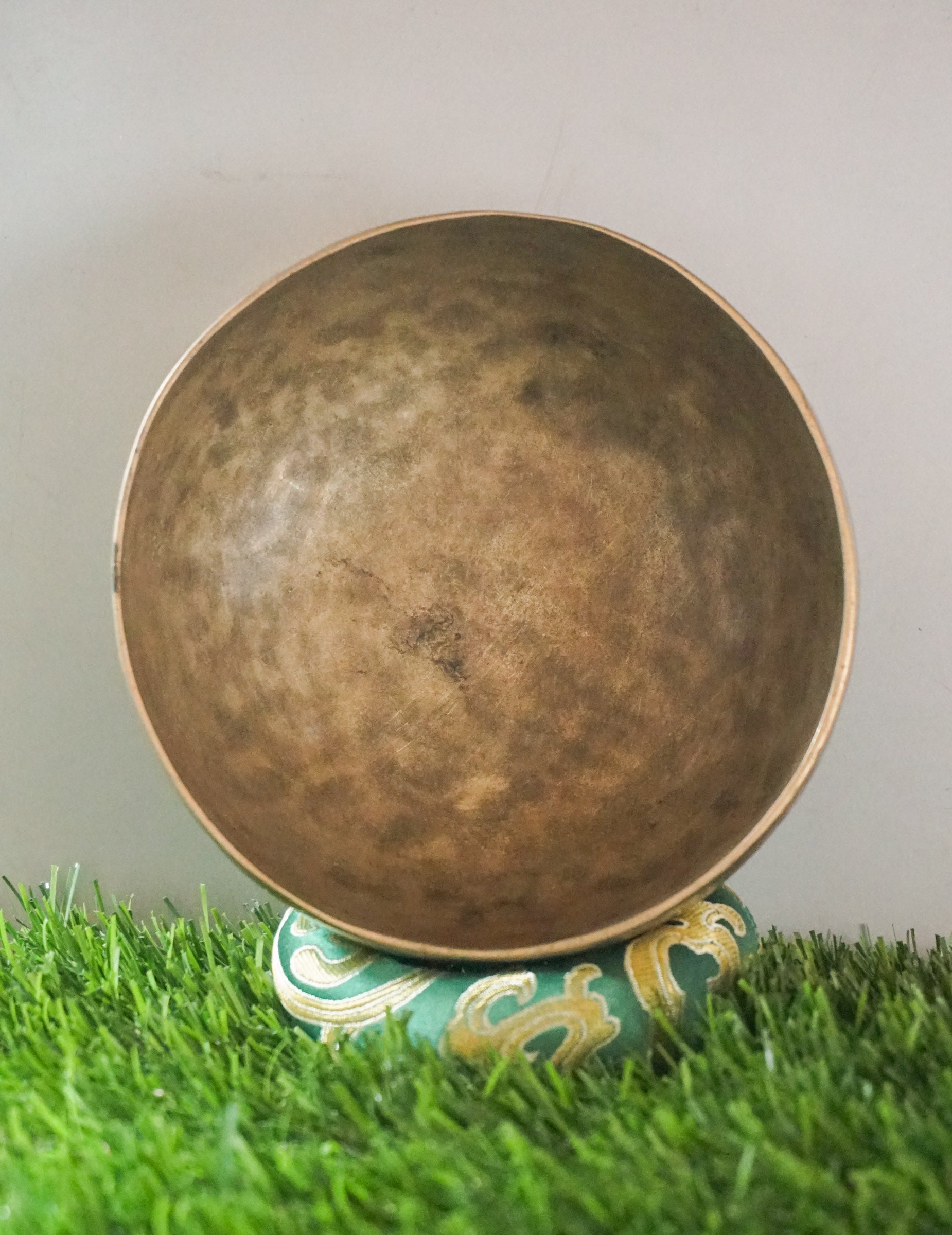 Vintage Tibetan singing bowl handcrafted in Nepal with aged patina.