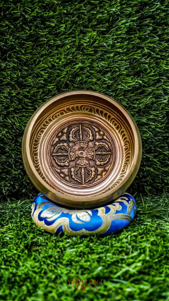 Singing bowl featuring the sacred Vajra symbol at its center, symbolizing spiritual strength and transformation, with the Om Mani Padme Hum mantra engraved around the outside, offering a calming and focused energy.