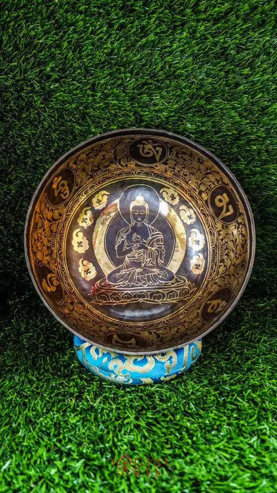 The Buddha Singing Bowl features a serene Buddha at the center surrounded by Om Mani Padme Hum syllables, with the full mantra on the outside. It produces a deep, steady tone that promotes calm, mindfulness, and inner peace. Perfect for meditation and reflection. Includes wooden mallet and silk cushion.