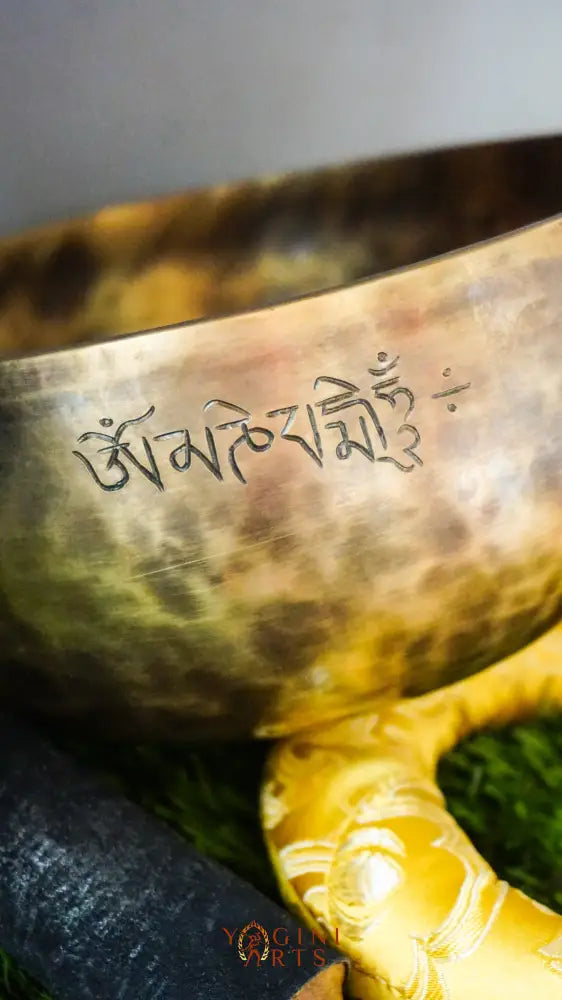 Moon Singing Bowl with lunar patterns, producing deep, resonant tones that enhance meditation, energy healing, and spiritual balance, hand-crafted in Nepal.