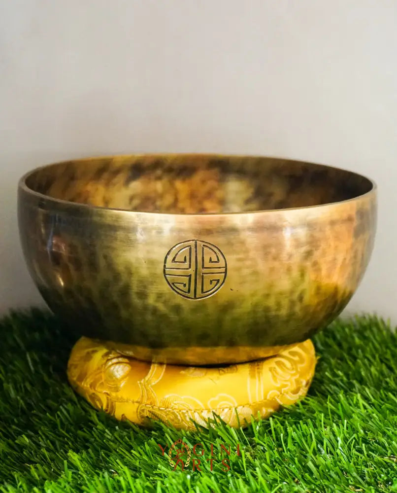 Moon Singing Bowl with lunar patterns, producing deep, resonant tones that enhance meditation, energy healing, and spiritual balance, hand-crafted in Nepal.
