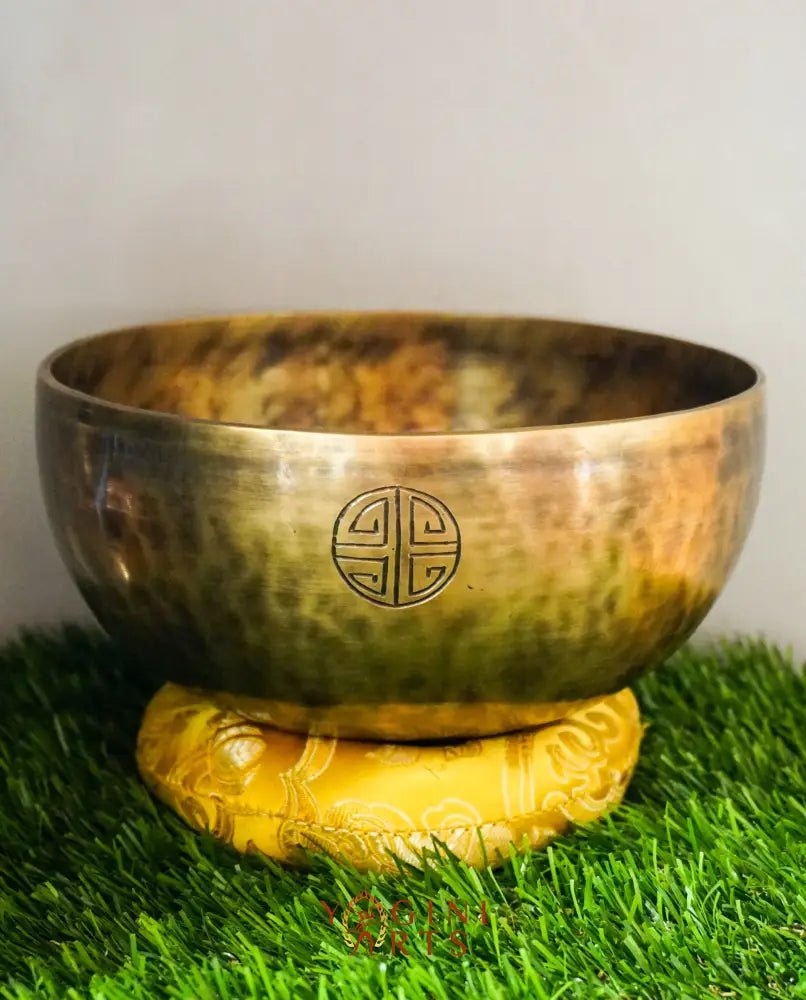 Moon Singing Bowl with lunar patterns, producing deep, resonant tones that enhance meditation, energy healing, and spiritual balance, hand-crafted in Nepal.
