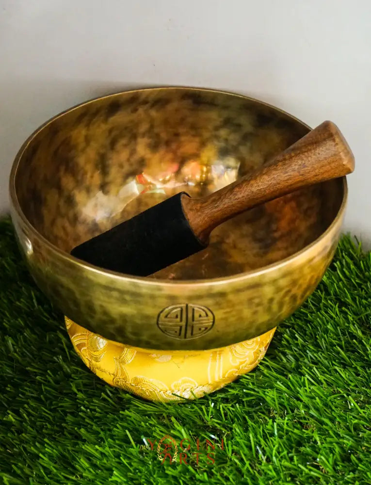 Moon Singing Bowl with lunar patterns, producing deep, resonant tones that enhance meditation, energy healing, and spiritual balance, hand-crafted in Nepal.