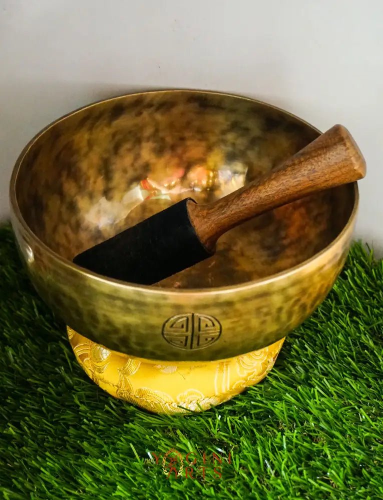Moon Singing Bowl with lunar patterns, producing deep, resonant tones that enhance meditation, energy healing, and spiritual balance, hand-crafted in Nepal.