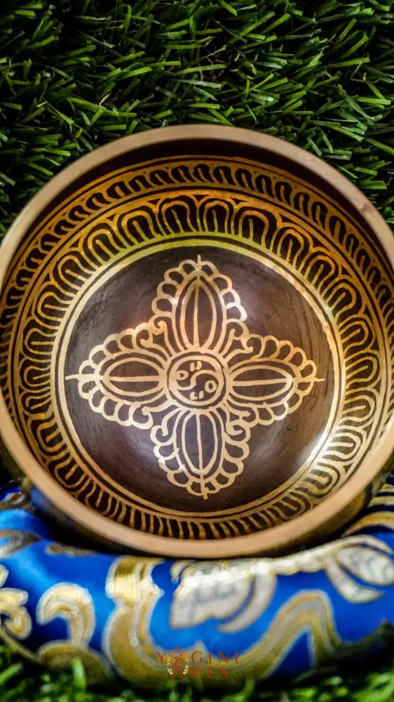 Harness grounding energy with this Double Dorje Singing Bowl, adorned with protective symbolism and sacred mantras. Its rich, resonant tones create the perfect foundation for meditation and mindfulness practice. Includes mallet and cushion for immediate use.