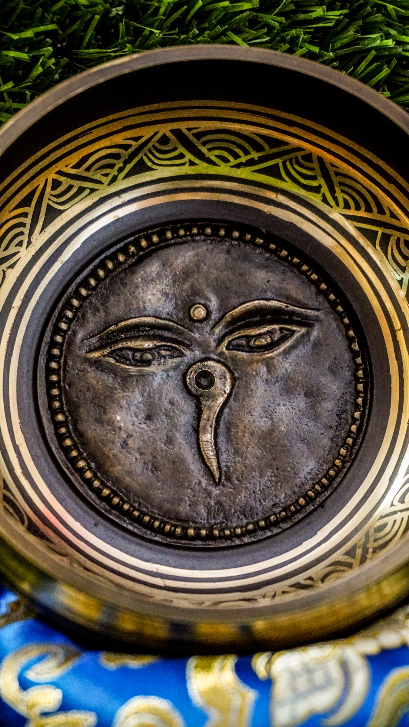 The Carved Buddha Eye Singing Bowl features the Buddha Eye symbol for spiritual clarity and protection. The Om Mani Padme Hum mantra circles the outside on mandala petals. Its clear, calming tones support meditation and mindfulness, bringing peace and focus to any space.