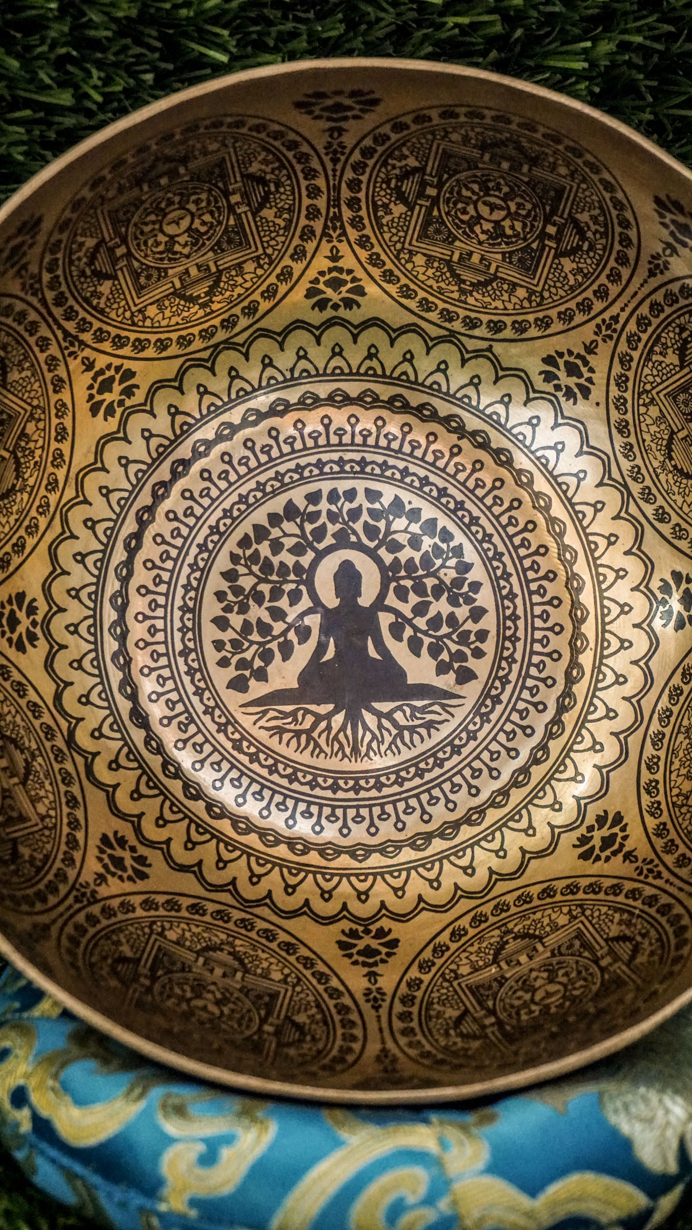 Connect to peace and clarity with our handcrafted Buddha Tree Singing Bowl. At its heart is an engraved Bodhi tree, a symbol of enlightenment and inner growth. Surrounding it, sacred Sanskrit mantras radiate healing and protection. Hand-hammered by Himalayan artisans, this bowl produces rich calming tones that support meditation, mindfulness, and emotional balance. It is a powerful companion for spiritual practice, healing rituals, or creating a serene space in your home.