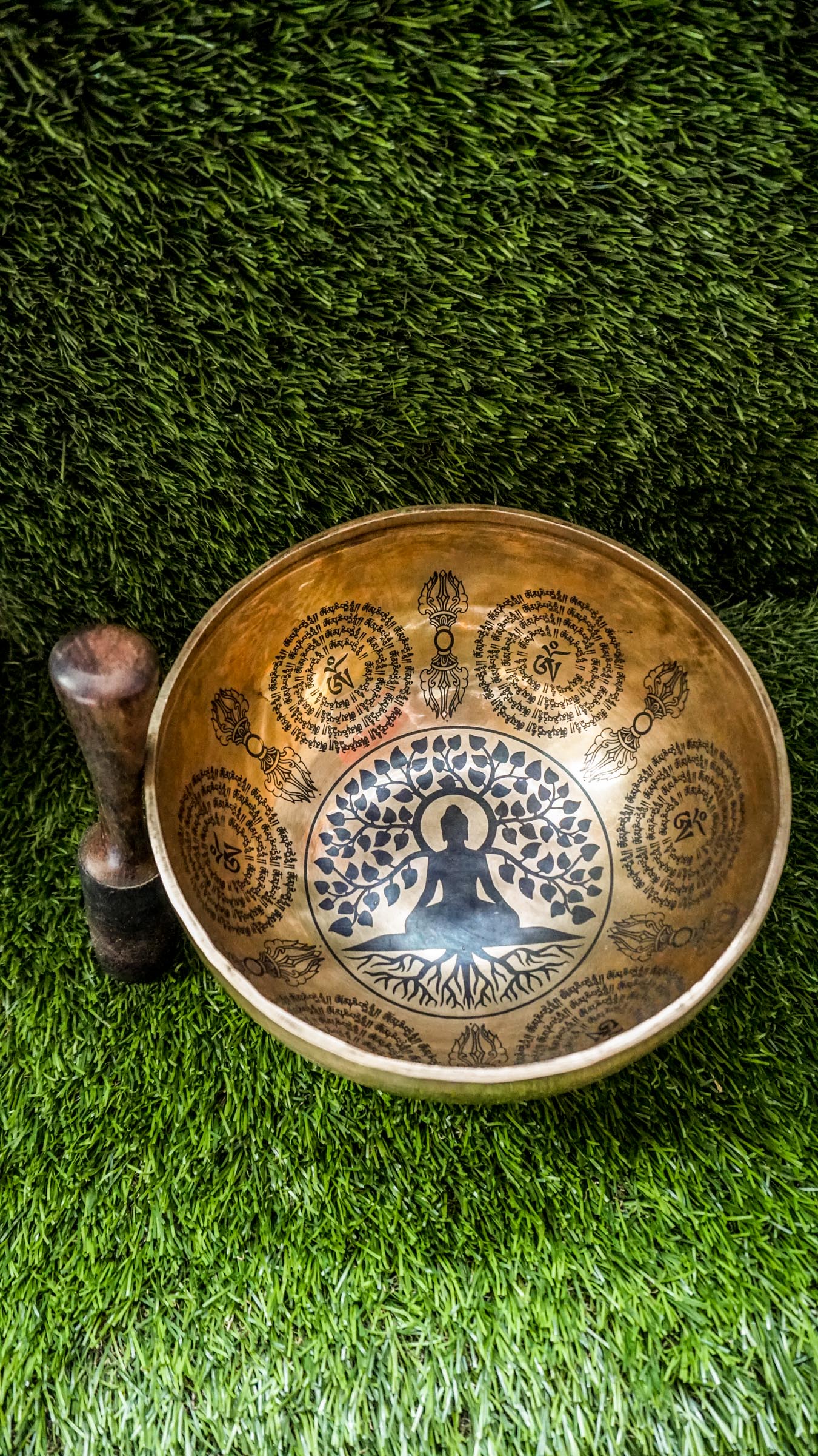 This handcrafted Buddha Tree Singing Bowl features a detailed Bodhi tree engraving, symbolizing enlightenment and spiritual resilience. Sacred Sanskrit mantras around the rim enhance its energy-cleansing power. Hand-hammered by Himalayan artisans, it produces deep, calming tones ideal for meditation, healing, and mindfulness. A perfect tool to ground your energy, raise your vibration, and deepen your spiritual practice.