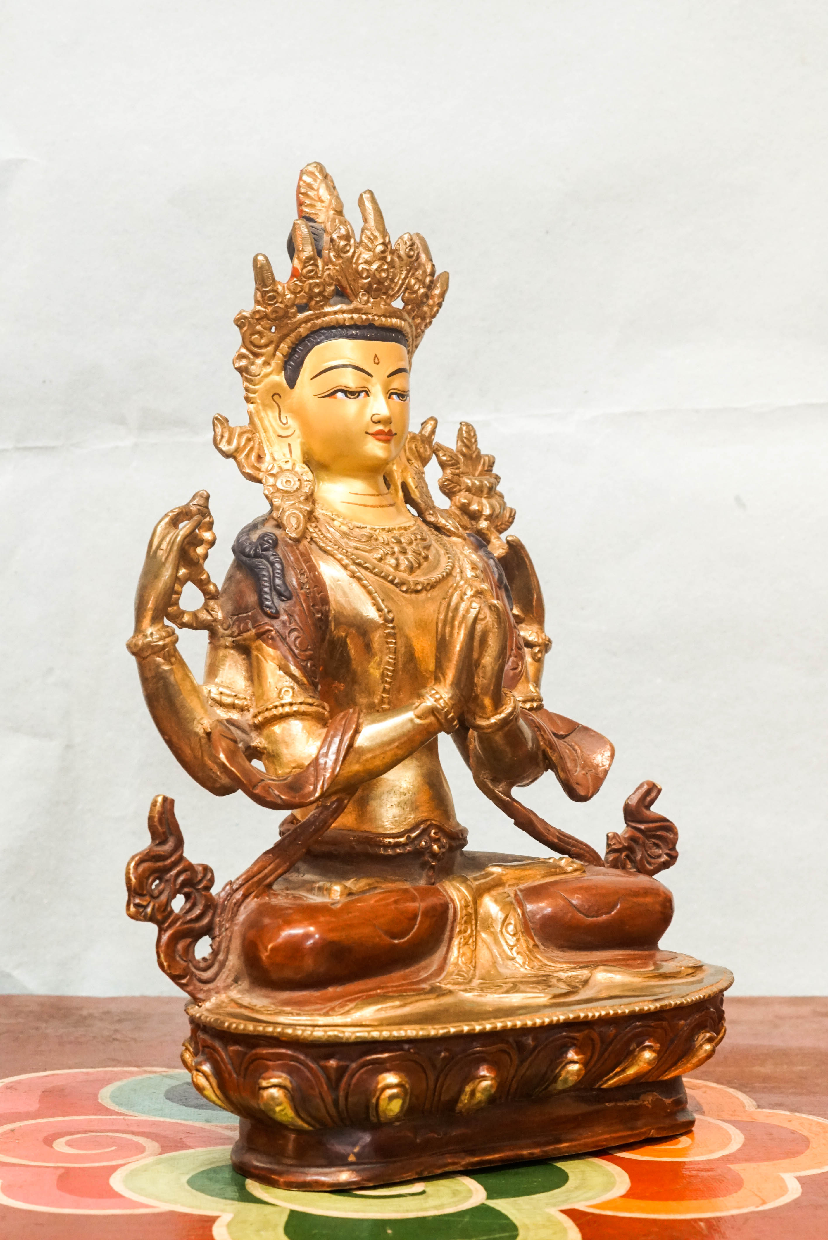 Chenrezig statue depicts the Bodhisattva of Compassion in four-armed form seated on a lotus pedestal.  Ideal for meditation altars or spiritual decor, it inspires mindfulness, healing, and heartfelt compassion in any space.
