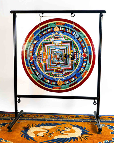 Kalachakra Mandala gong featuring colorful sacred geometry, Tibetan script, Buddhist symbols, and traditional Nepalese artwork