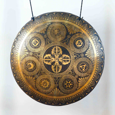 Ashtamangala gong featuring the Eight Auspicious Symbols with detailed golden Buddhist artwork and traditional Nepalese craftsmanship