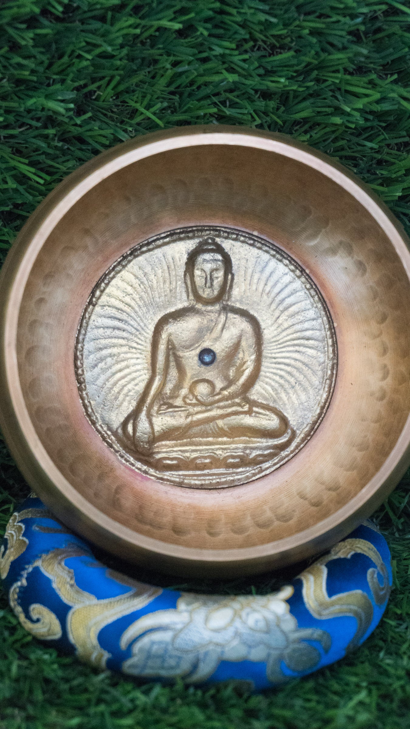 Invite mindfulness and calm with our handcrafted Dotted Buddha Singing Bowl. Featuring an engraved Buddha surrounded by a dotted mandala symbolizing stillness and spiritual balance, this bowl reminds you to stay present. Traditional mantras circle the rim, adding protection and spiritual energy. Handcrafted by skilled Himalayan artisans, it produces soothing tones that quiet the mind and support meditation, breathwork, and daily mindfulness practice.








