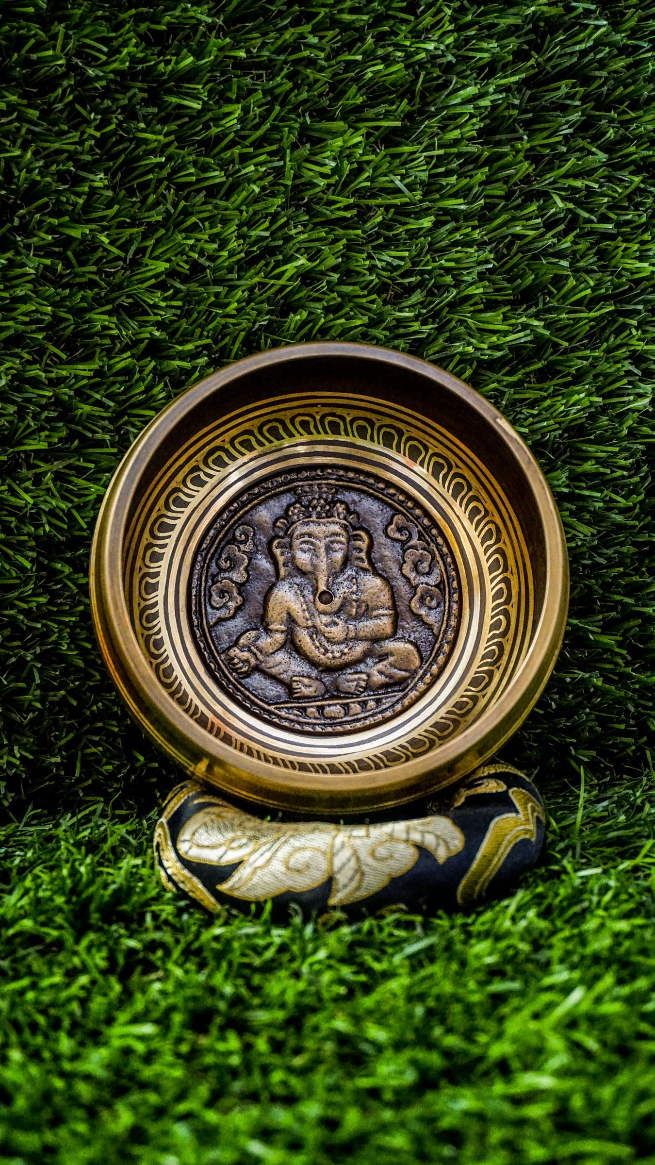 
The Ganesh Singing Bowl carries the energy of new beginnings and wisdom. With Lord Ganesh carved at its center, it symbolizes success, protection, and clarity. Simple outer patterns keep the focus on this sacred figure. Its smooth, grounding tone calms the mind and supports meditation or intention setting, making it a meaningful companion for strength and mindful energy.