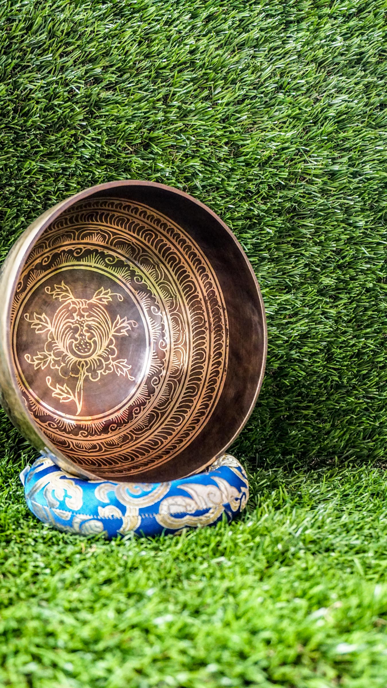The Lotus Singing Bowl is a gentle reminder of inner peace and spiritual growth. A blooming lotus sits at its center, symbolizing purity and awakening. Around the bowl, each Om Mani Padme Hum syllable rests in a flower-like form, blending mantra and beauty. Its soft, steady tone supports stillness, clarity, and calm.