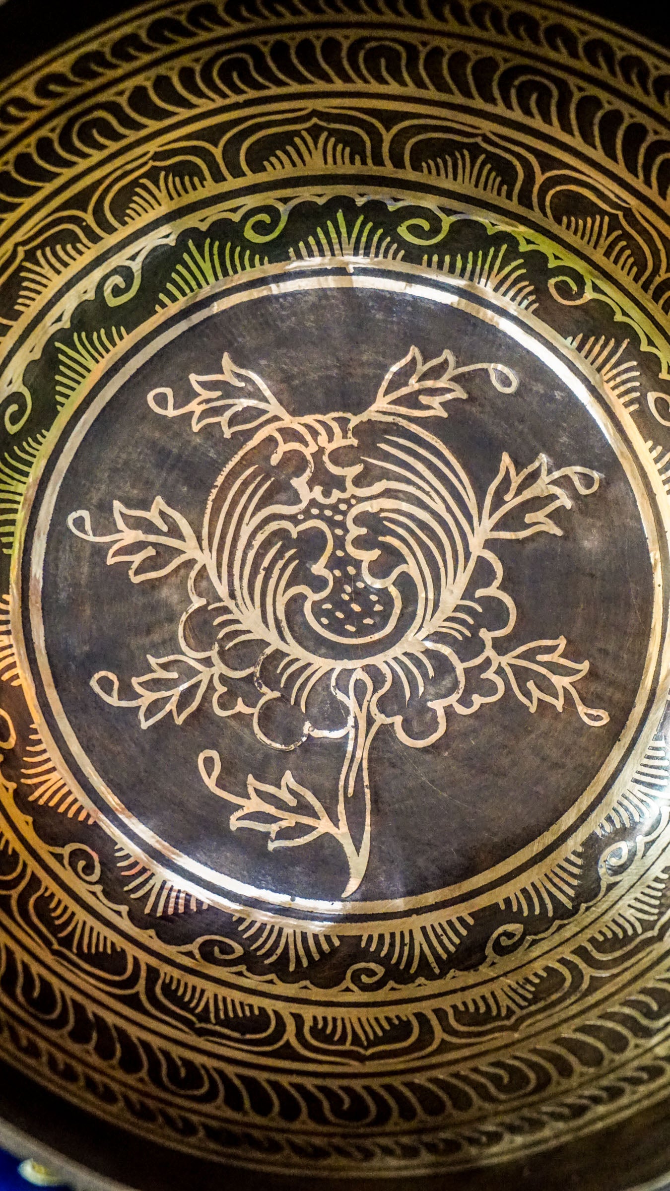 The Lotus Singing Bowl is a gentle reminder of inner peace and spiritual growth. A blooming lotus sits at its center, symbolizing purity and awakening. Around the bowl, each Om Mani Padme Hum syllable rests in a flower-like form, blending mantra and beauty. Its soft, steady tone supports stillness, clarity, and calm.