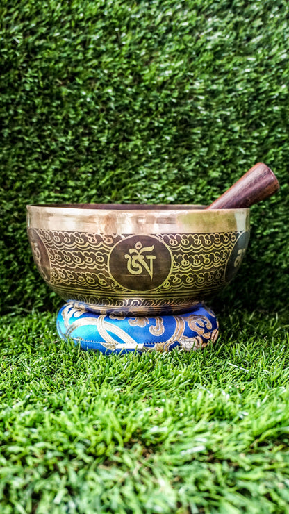 The Lotus Singing Bowl is a gentle reminder of inner peace and spiritual growth. A blooming lotus sits at its center, symbolizing purity and awakening. Around the bowl, each Om Mani Padme Hum syllable rests in a flower-like form, blending mantra and beauty. Its soft, steady tone supports stillness, clarity, and calm.