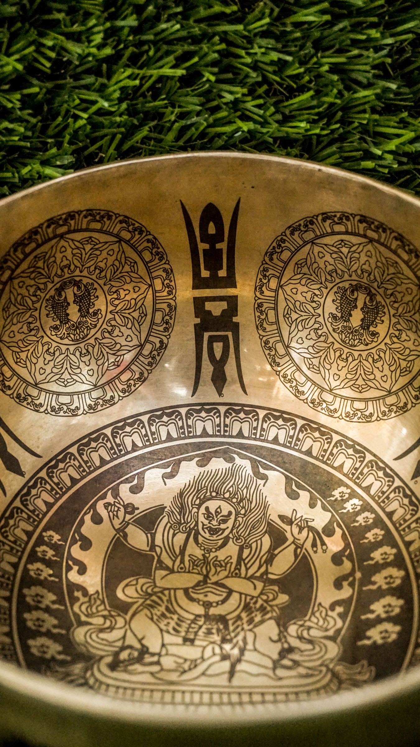 Invite protection, strength, and transformation with our handcrafted Mahakala Singing Bowl. Featuring a finely engraved image of Mahakala inside, it symbolizes fearless guardianship and obstacle removal. The exterior is adorned with protective motifs to deepen its sacred energy. Handmade by skilled artisans, this bowl produces deep, grounding tones that support meditation and spiritual empowerment. Includes a wooden mallet and silk cushion for easy use and care.