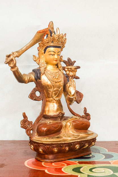 Manjushri statue symbolizes wisdom and enlightenment. Featuring a flaming sword and sacred scripture, it is perfect for meditation altars or home. It  inspires clarity, spiritual growth, and mental sharpness