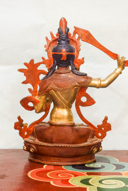Manjushri statue symbolizes wisdom and enlightenment. Featuring a flaming sword and sacred scripture, it is perfect for meditation altars or home. It  inspires clarity, spiritual growth, and mental sharpness.